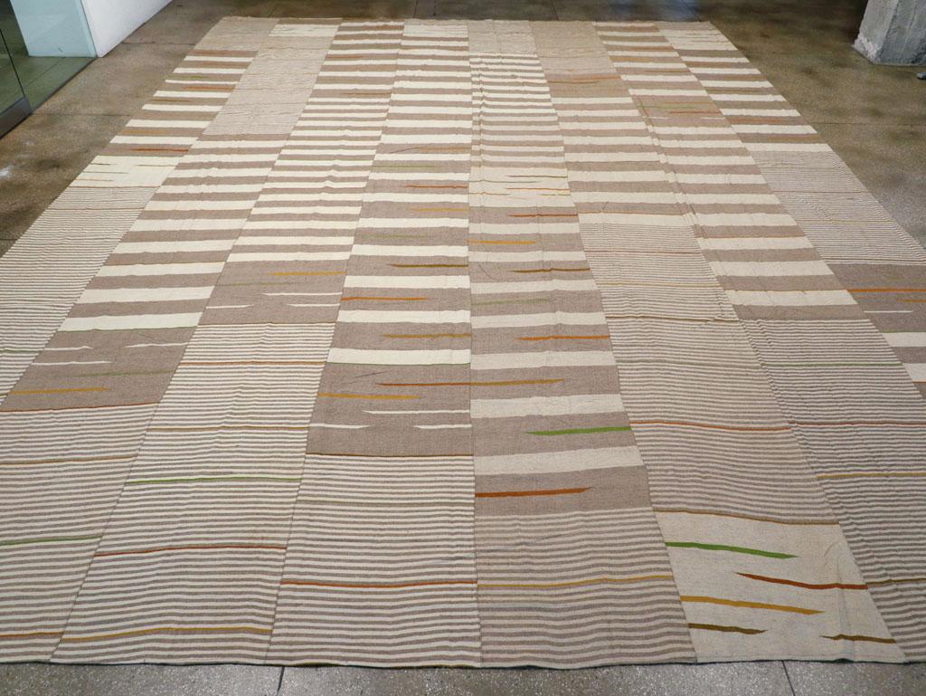 This 21st century Turkish Flatweave Kilim rug, measuring 15' 10