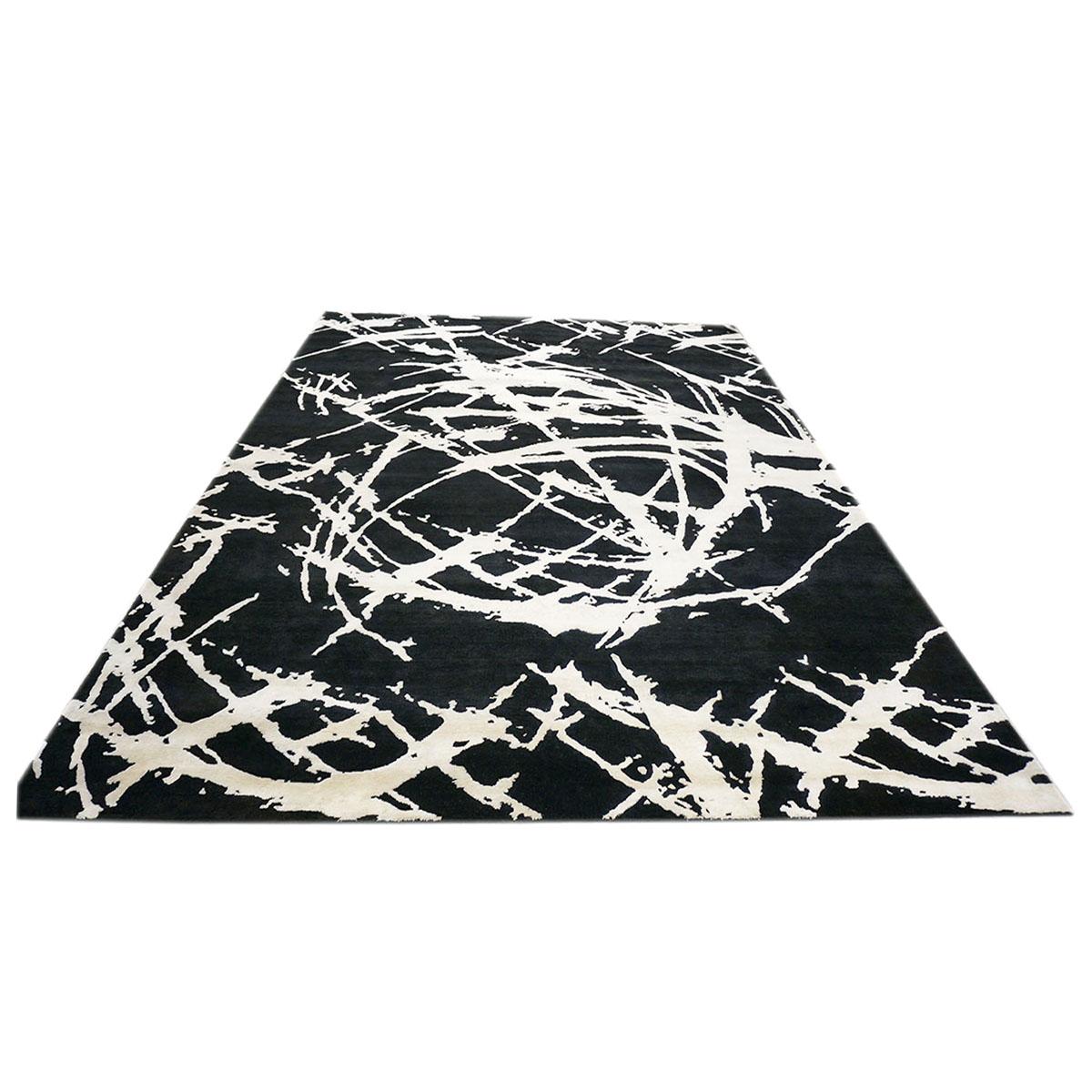 Ashly fine rugs presents a new modern inspired wool & silk 9x12 black & white handmade area rug with lustrous shiny fibers and a thick durable pile. This gorgeous collection has been designed by our in-house designer and handmade by the skilled