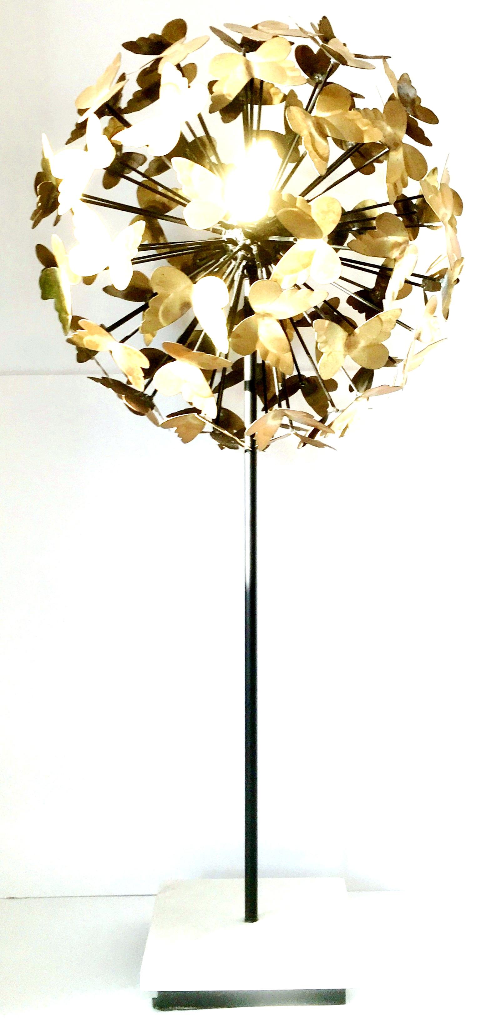 21st century brass, iron and marble butterfly sphere sculpture. This unique piece features an iron sphere with brass butterflies on a white marble base.
The marble base is 7.5