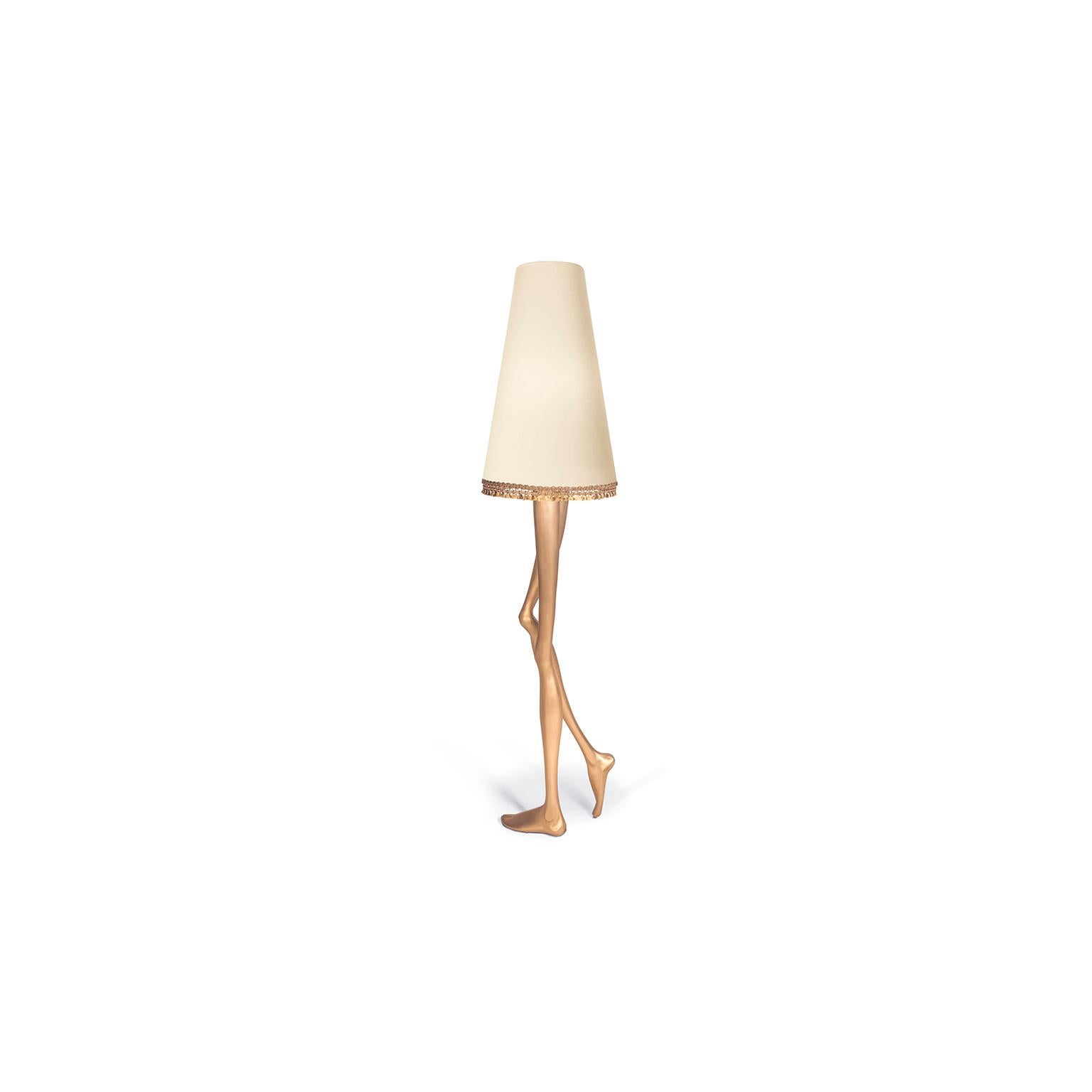 Inspiration:  
Marilyn Monroe, the sexiest Pin-up of the 1950s, inspired a piece of Art & Design. The design of the Monroe lamp captures the essence of her image and the sensuality of her legs. The lampshade and the gold tassel fringe complement the
