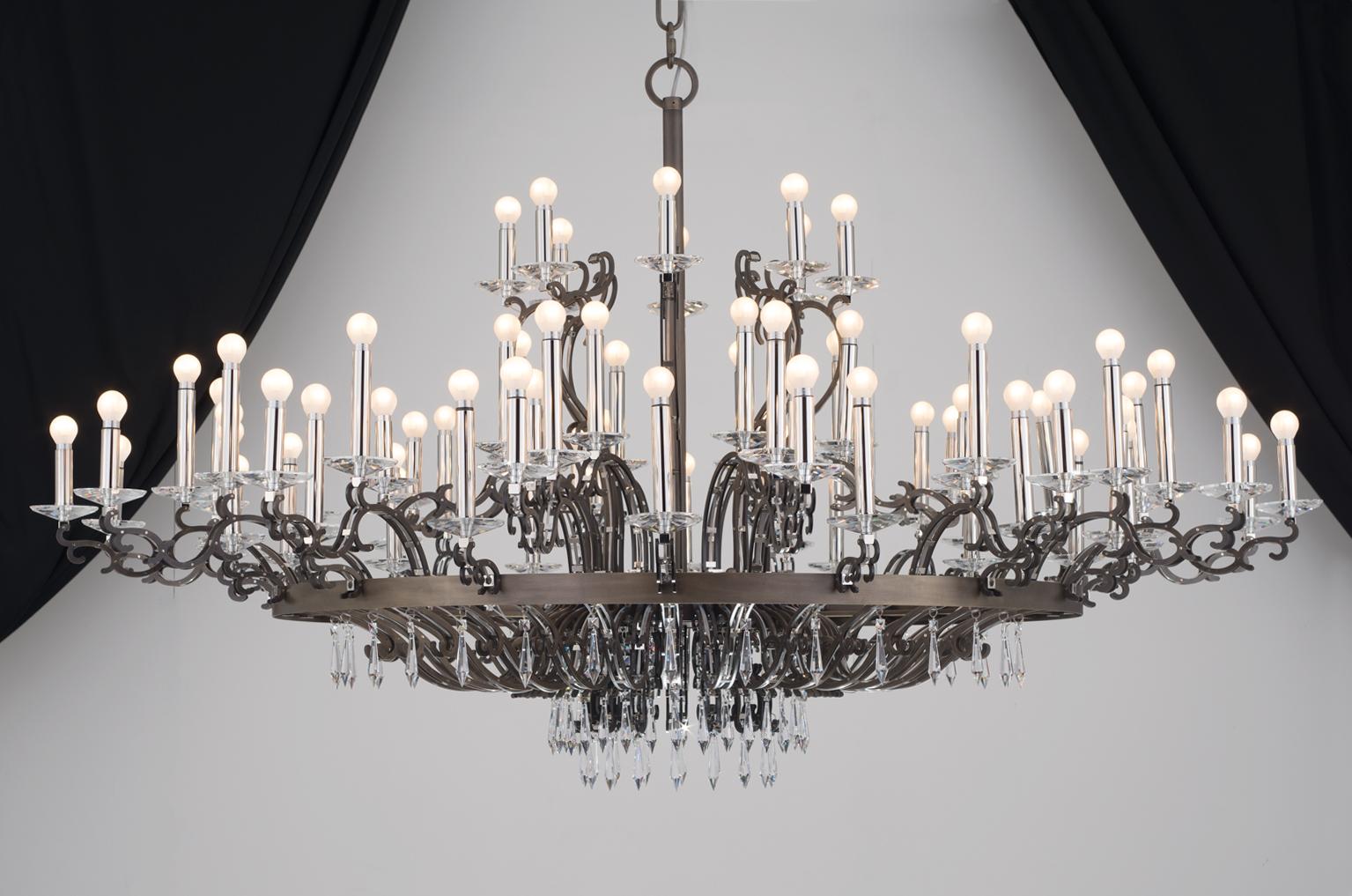 This model is a chandelier full of personality and attitude. Just like Morgan Le Fay who was a powerful feminine figure in celtic mythology, her main feature is the elegant and solid metallic structure, characterised by curves that chase each other