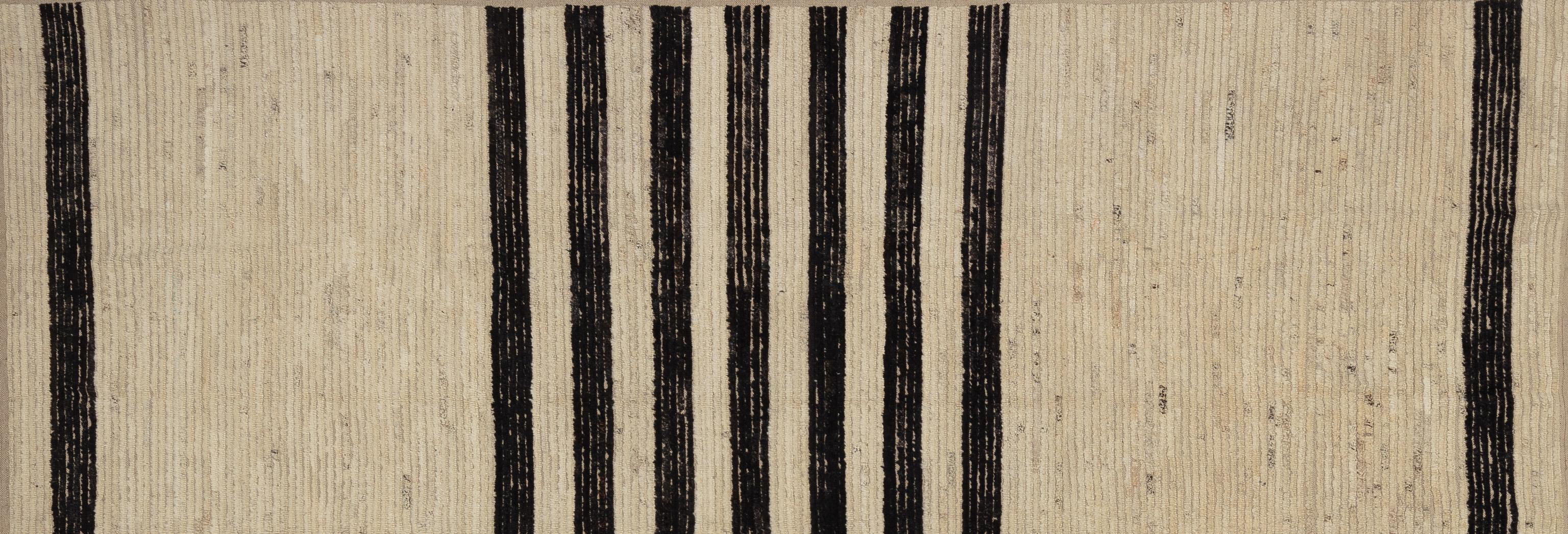 Elevate your home décor with this beautiful Moroccan rug, a true masterpiece of artisan craftsmanship. Featuring intricate patterns and captivating tones. This rug adds a touch of exotic elegance to any room. Handwoven with care and expertise, each