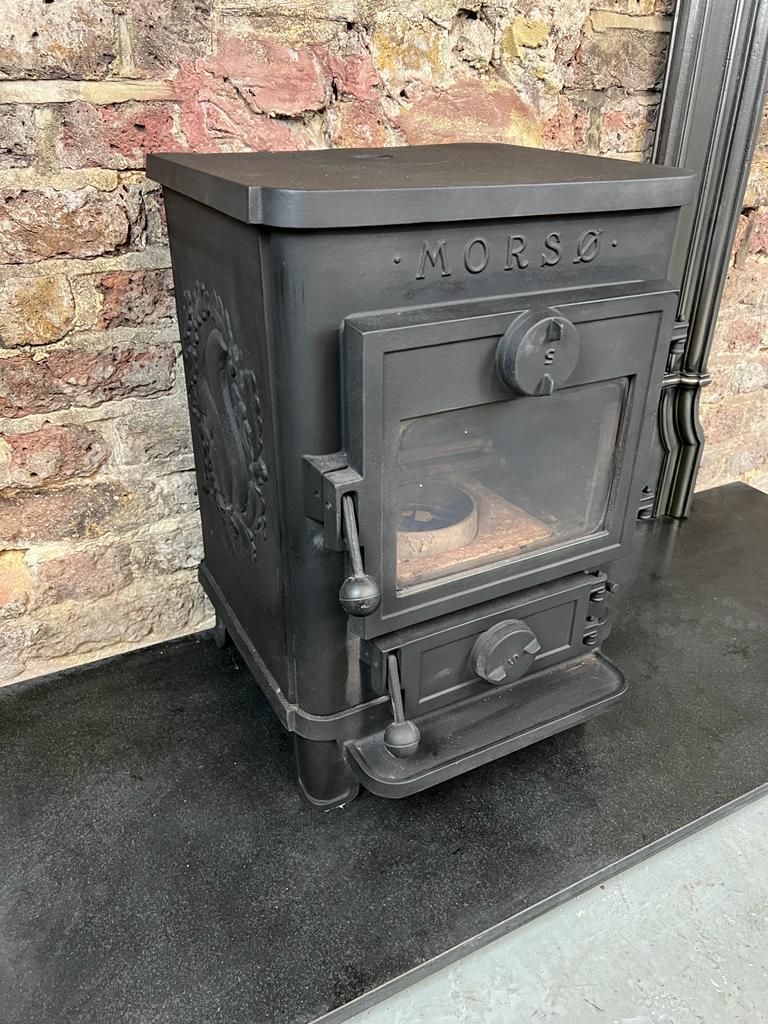 21st Century Morso wood burning stove.
Manufactured in Denmark, made in sturdy cast-iron - the best imaginable material for a woodburning stoves.
rear or top flue exit. this has been salvaged from a london hampstead cottage.
branded and cast with
