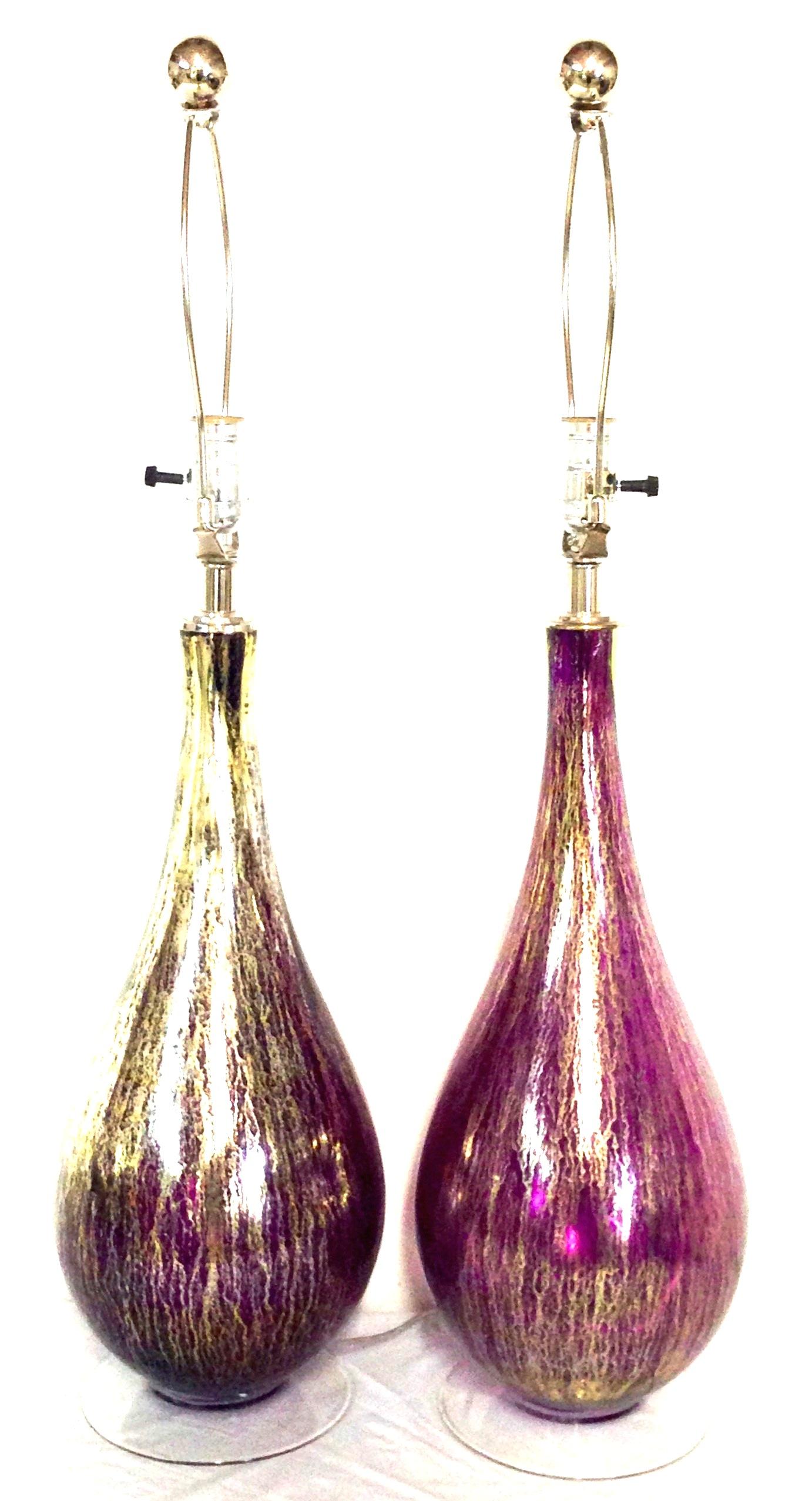 21st Century Murano style pair of Two blown glass amethyst and 22-karat gold infused table lamps. This pair of new and finely crafted blown glass lamps feature a deep, vivid amethyst tone with gold infused body, clear glass base and silver chromed