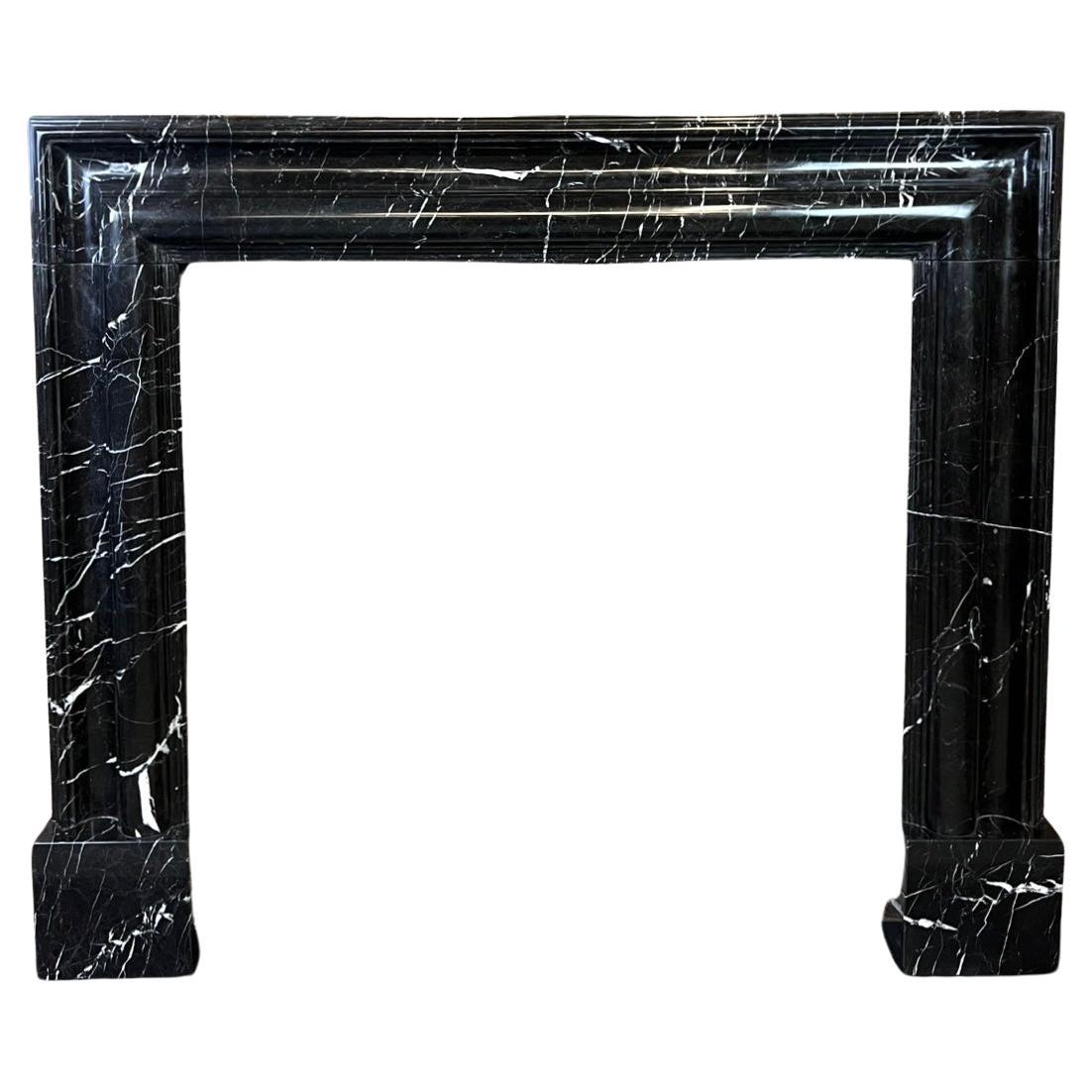 21st Century Nero Bolection Marble Fireplace Surround.
This Luxury Black Marble Fireplace Mantlepiece Is Hand Carved From Nero Marquina Marble With A Bolection Mouding.
It has Nice Flowing White Veins. The Marble Has Been Lightly Polished In Order