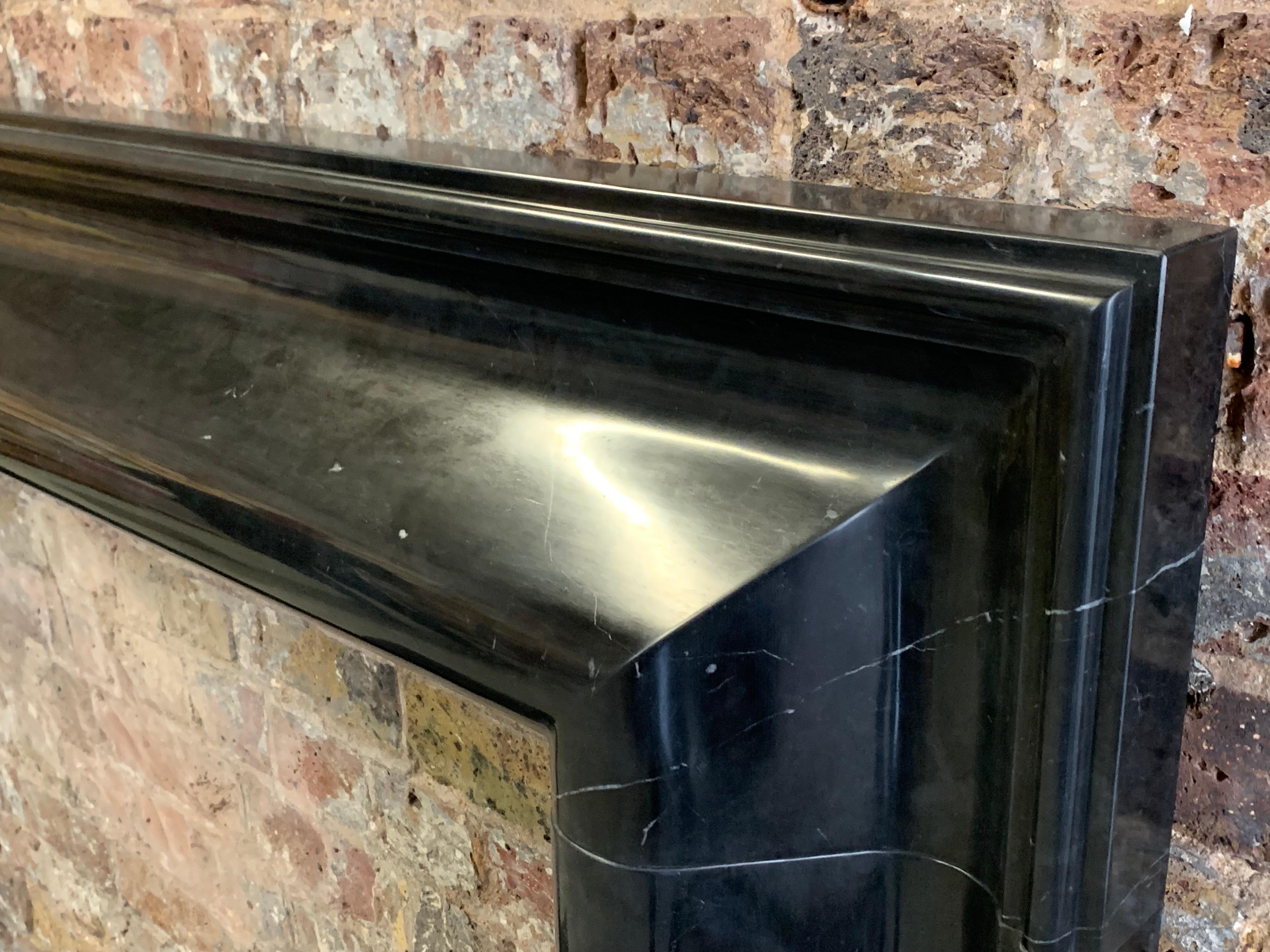 English 21st Century Nero Marquina Marble Bolection Fireplace