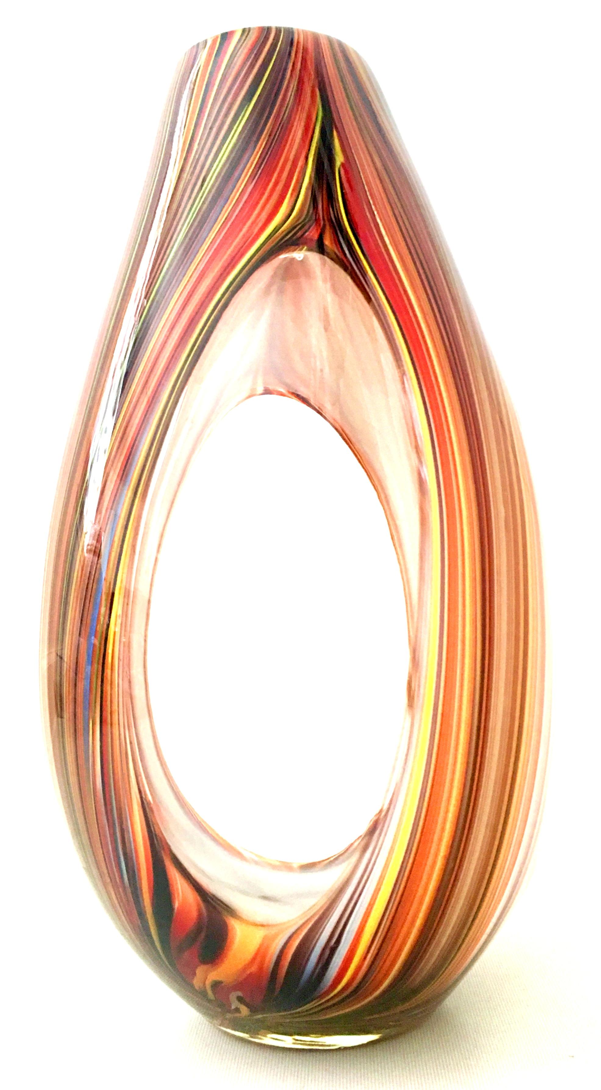 21st Century & New Missoni large modern optical striped blown glass vase. This new and never used ultra modern optical striped based designed by Missoni features a color palette with shades of orange, yellow, periwinkle, red and brown. This cased