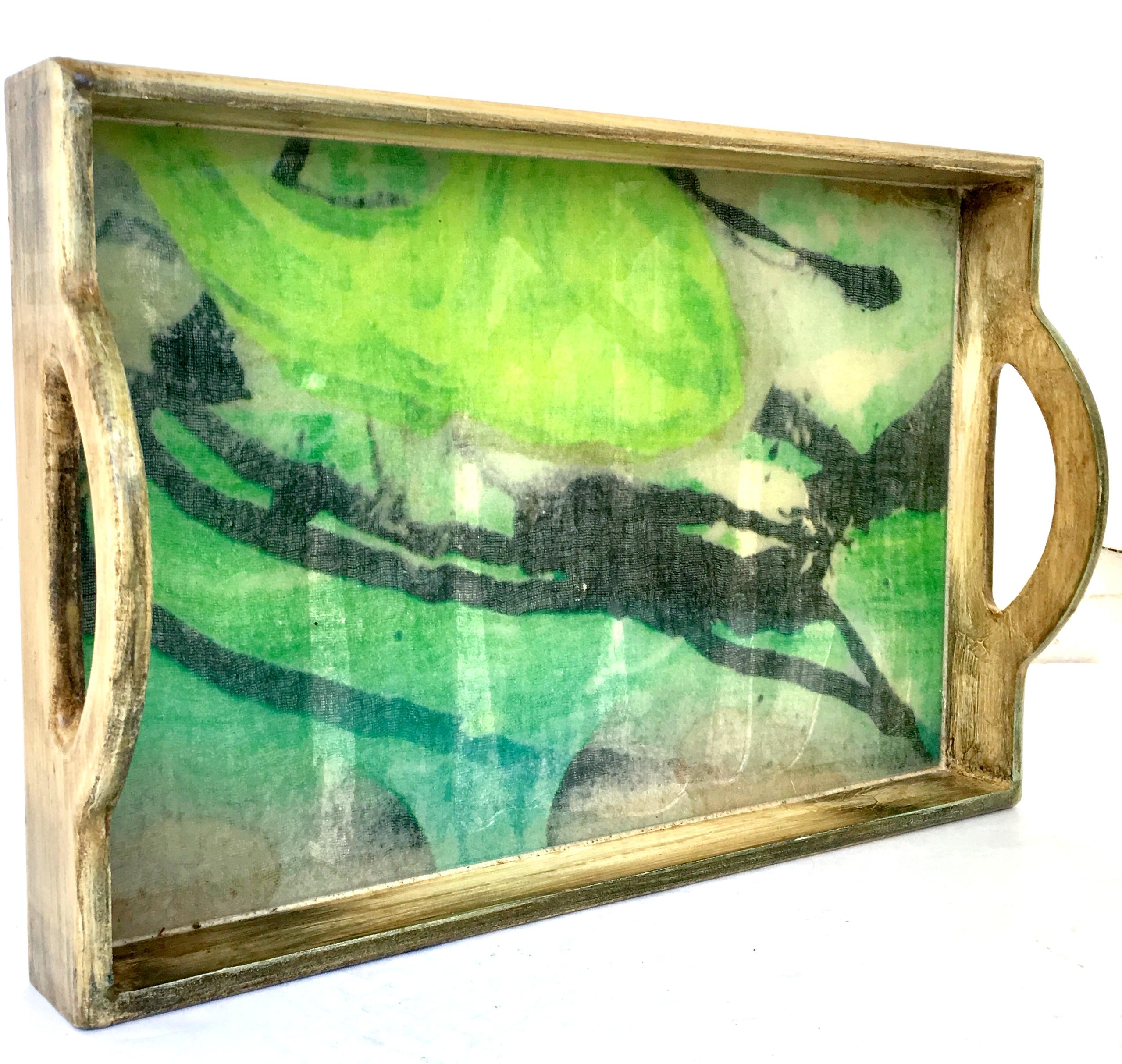 21st Century & new solid wood printed Belgium linen under clear Lucite cutout handle serving tray. This organic modern rectangular tray features solid wood faux distressed lacquered finish and a abstract vibrant green and black motif printed Belgium