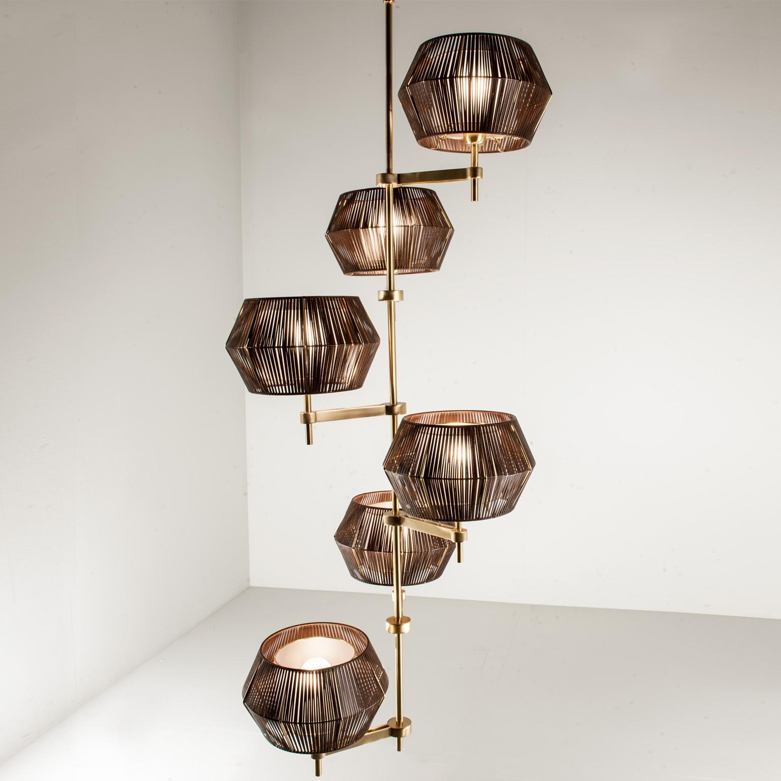 The peculiarity that makes this collection unique is the lampshade and its particular shape: available in brown eco leather and white string. A system of repeating proportions and modules, wisely assembled by the experts hands of the artisans. The