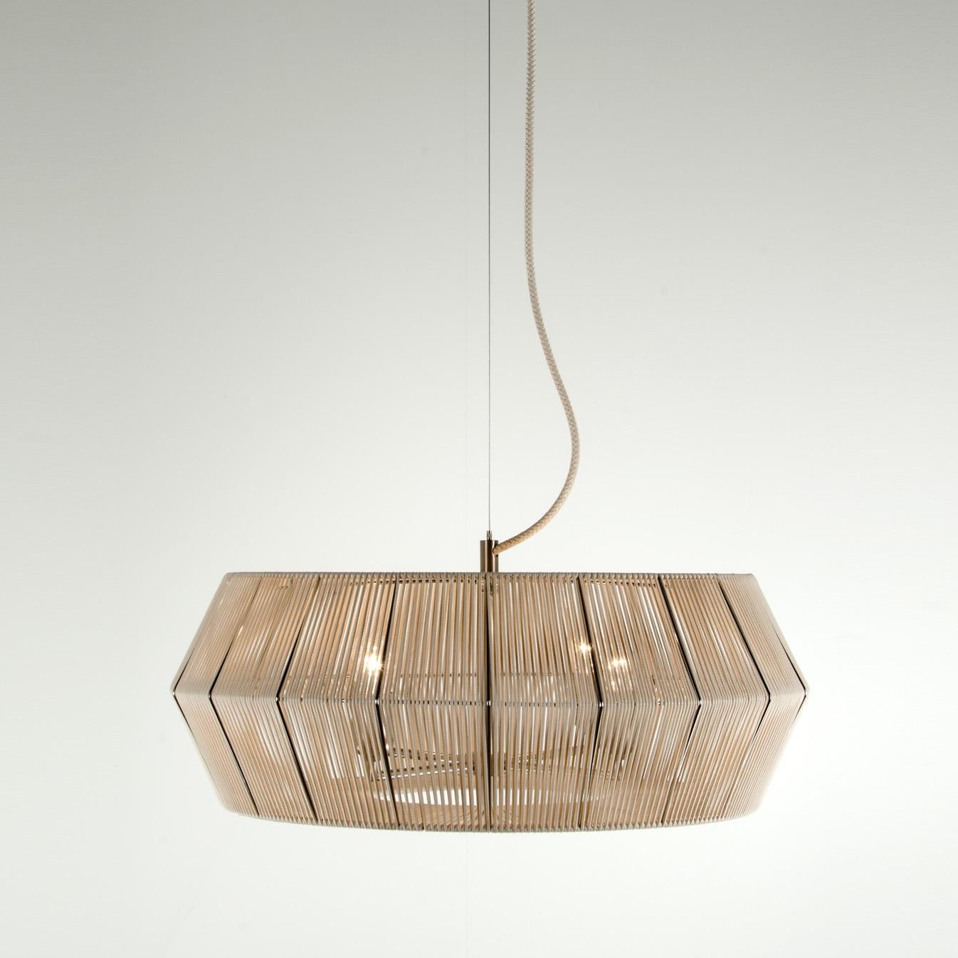The peculiarity that makes this collection unique is the lampshade and its particular shape: available in brown eco leather and white string. A system of repeating proportions and modules, wisely assembled by the experts hands of the artisans. The