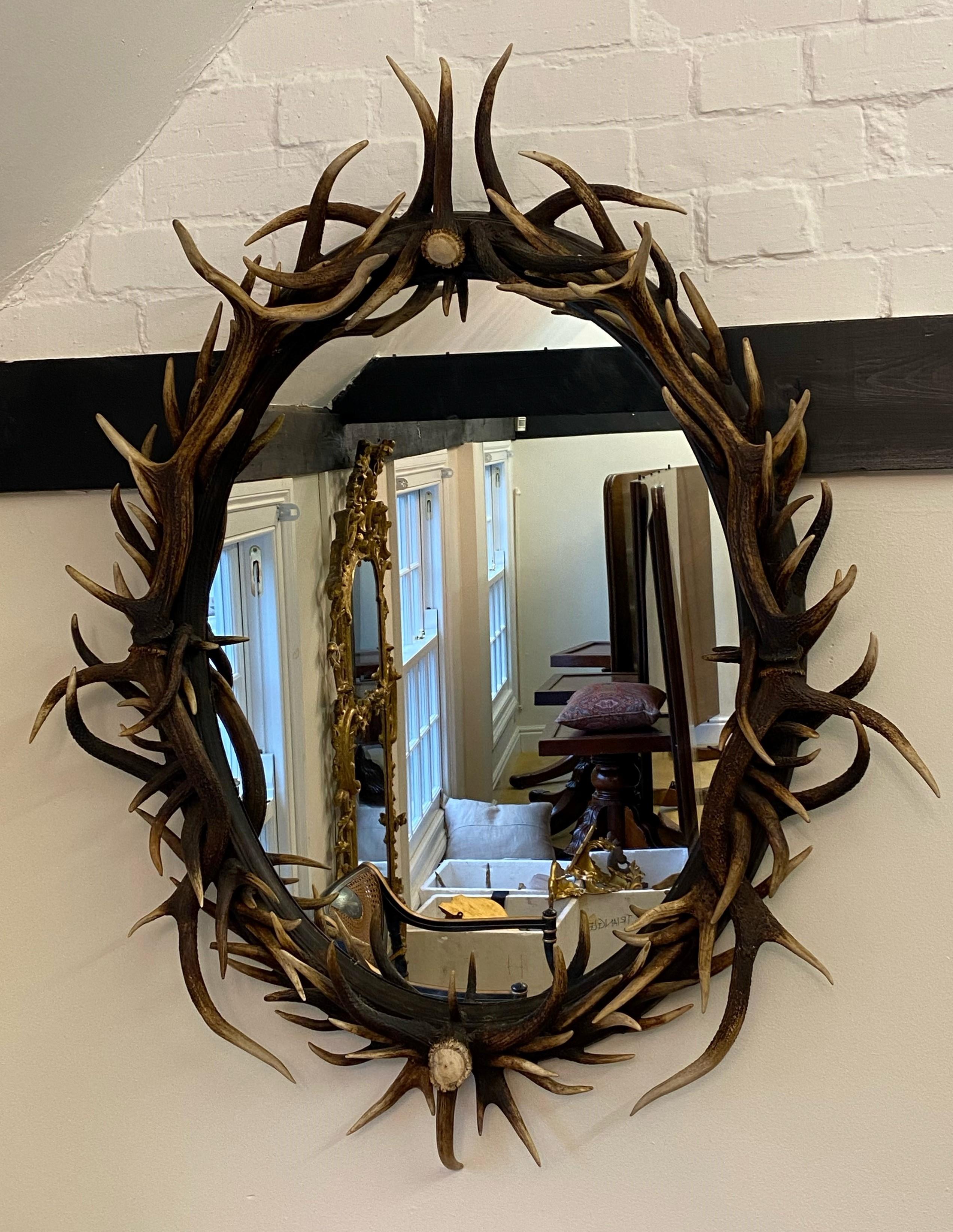 These beautifully imposing and unique large oval wall mirrors are comprised of naturally shed large red deer from Scotland surrounding an oval mirrored glass centre. The individual natural beauty of the antler horn combined with the functionality