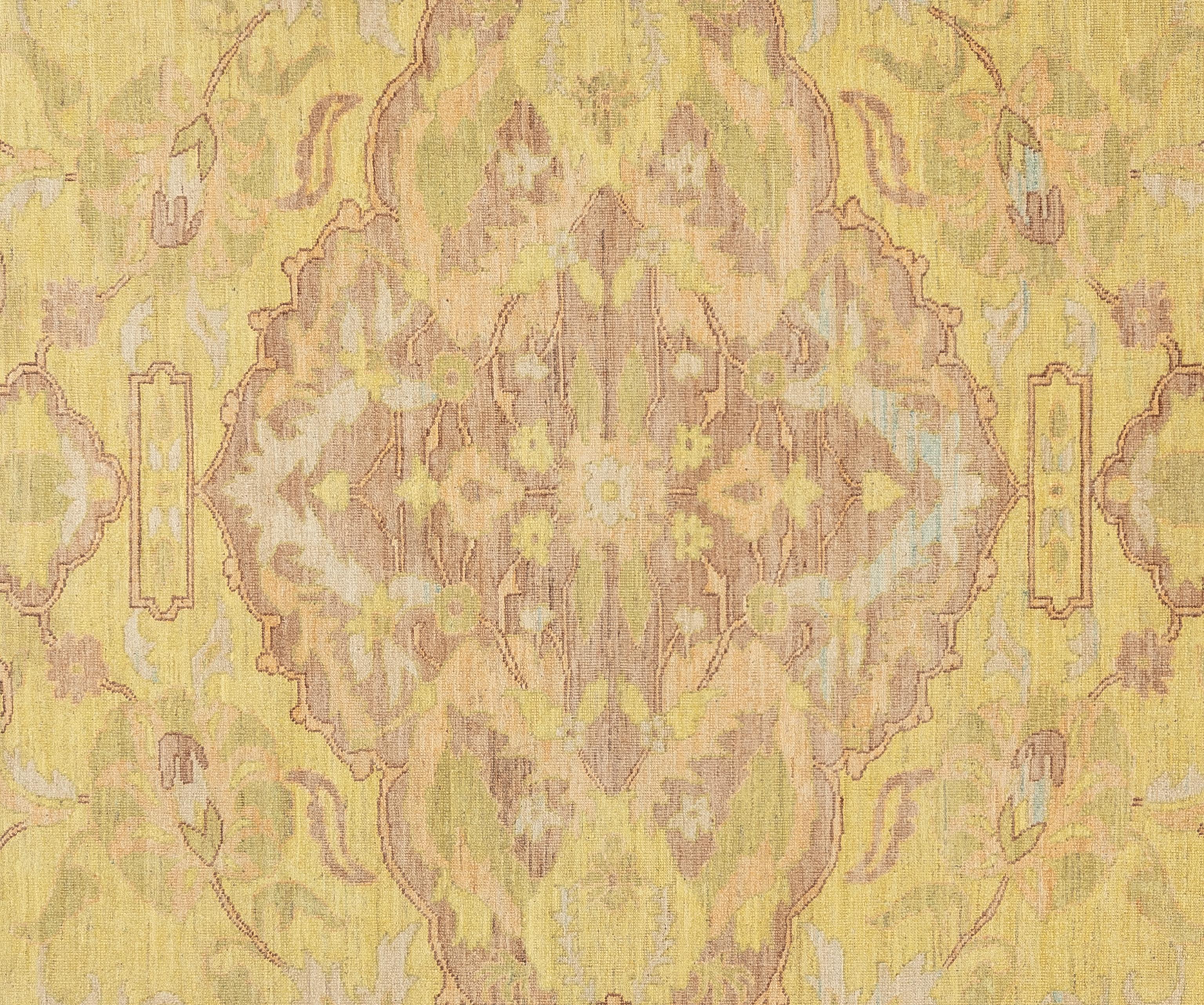 This exquisite Oushak rug is a true work of art skillfully handwoven by experienced artisans using traditional methods. Adorned with intricate patterns and a gentle color scheme crafted from natural vegetable dyes, this rug, is a striking focal