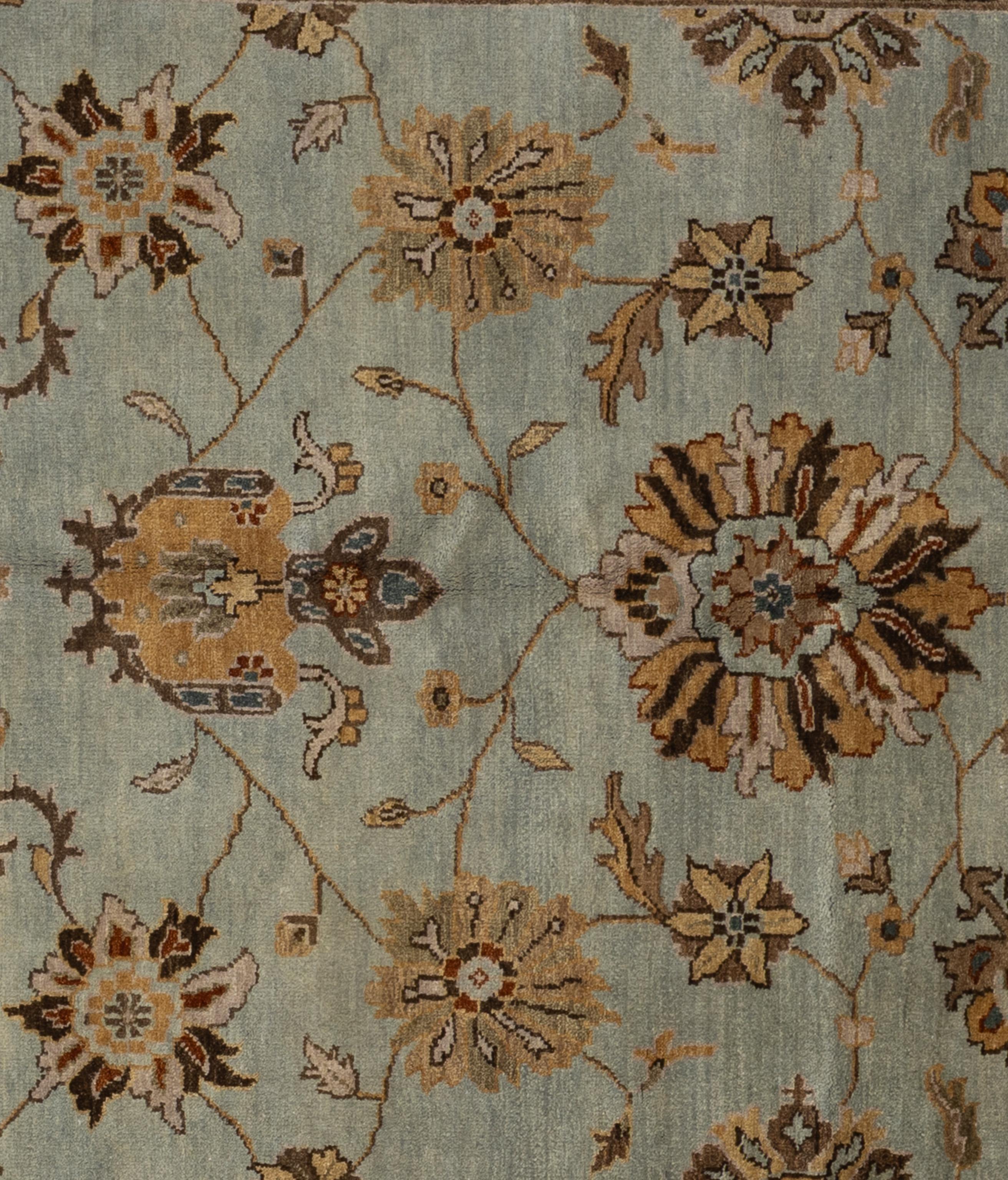 This exquisite Oushak rug is a true work of art skillfully handwoven by experienced artisans using traditional methods. Adorned with intricate patterns and a gentle color scheme crafted from natural vegetable dyes, this rug, is a striking focal