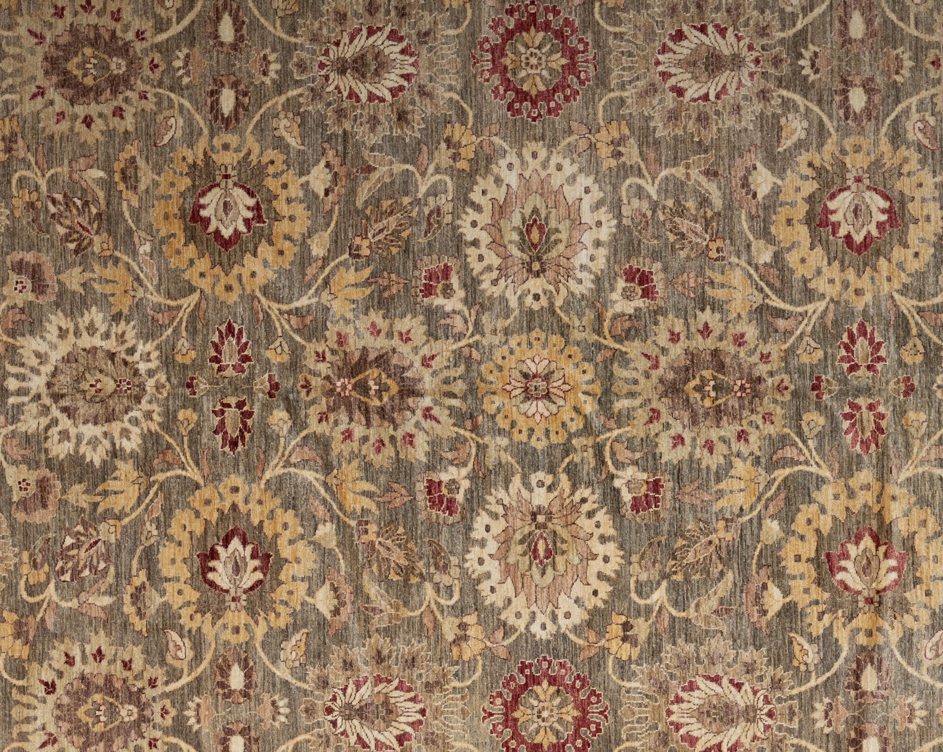 This Oushak rug from Pakistan is hand-knotted from pure wool, offering both durability and a soft, inviting texture underfoot. Its design draws inspiration from classic Anatolian motifs, reimagined in a soothing palette of neutral tones that bring a