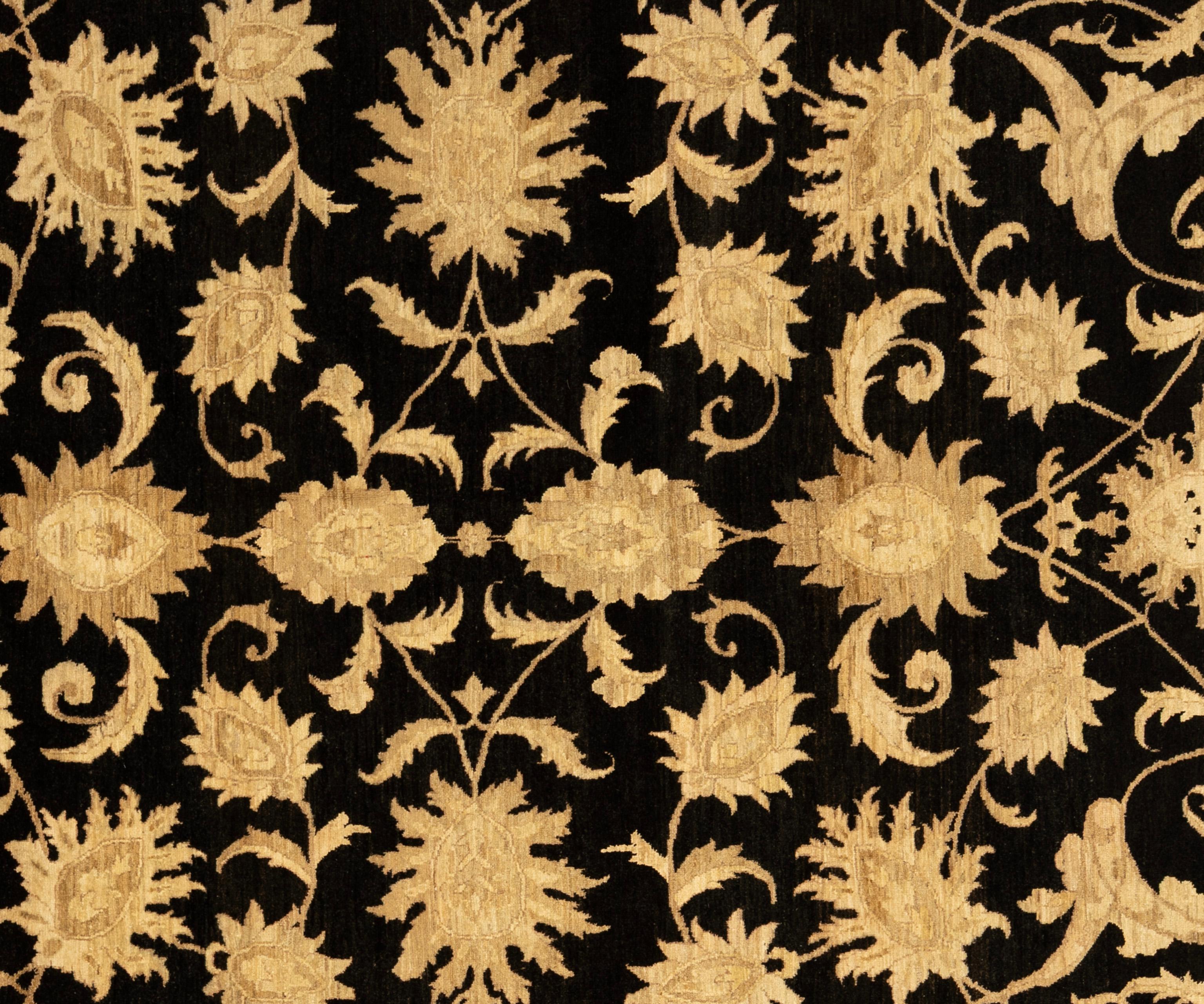 This Oushak rug from Pakistan is hand-knotted from pure wool, offering both durability and a soft, inviting texture underfoot. Its design draws inspiration from classic Anatolian motifs, reimagined in a soothing palette of neutral tones that bring a