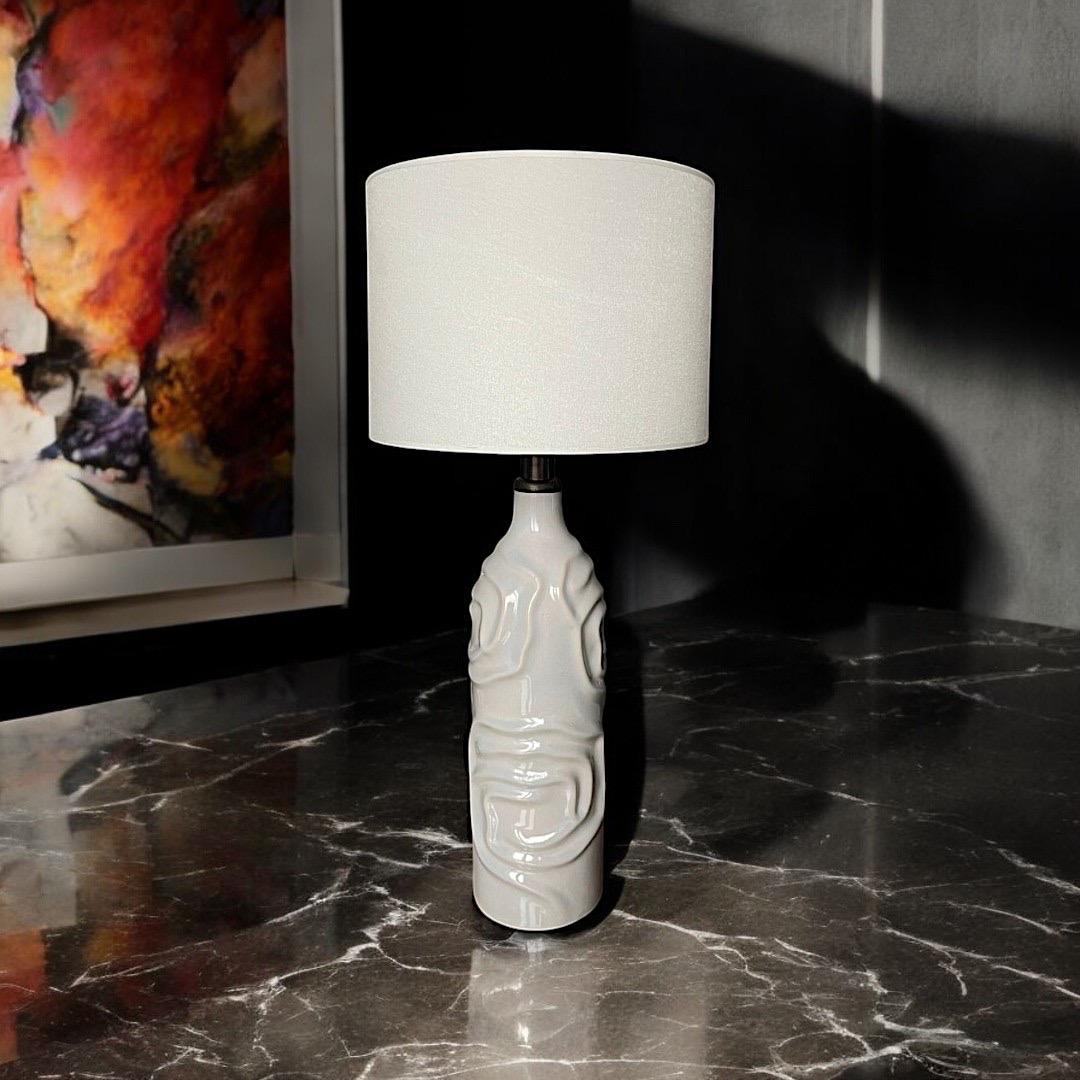 The Oyster Shell Lamp is an iconic design that brings the mesmerizing elegance of the sea into your living spaces. Crafted meticulously from ceramic, this lighting piece draws inspiration from the smooth texture and refined beauty of natural oyster