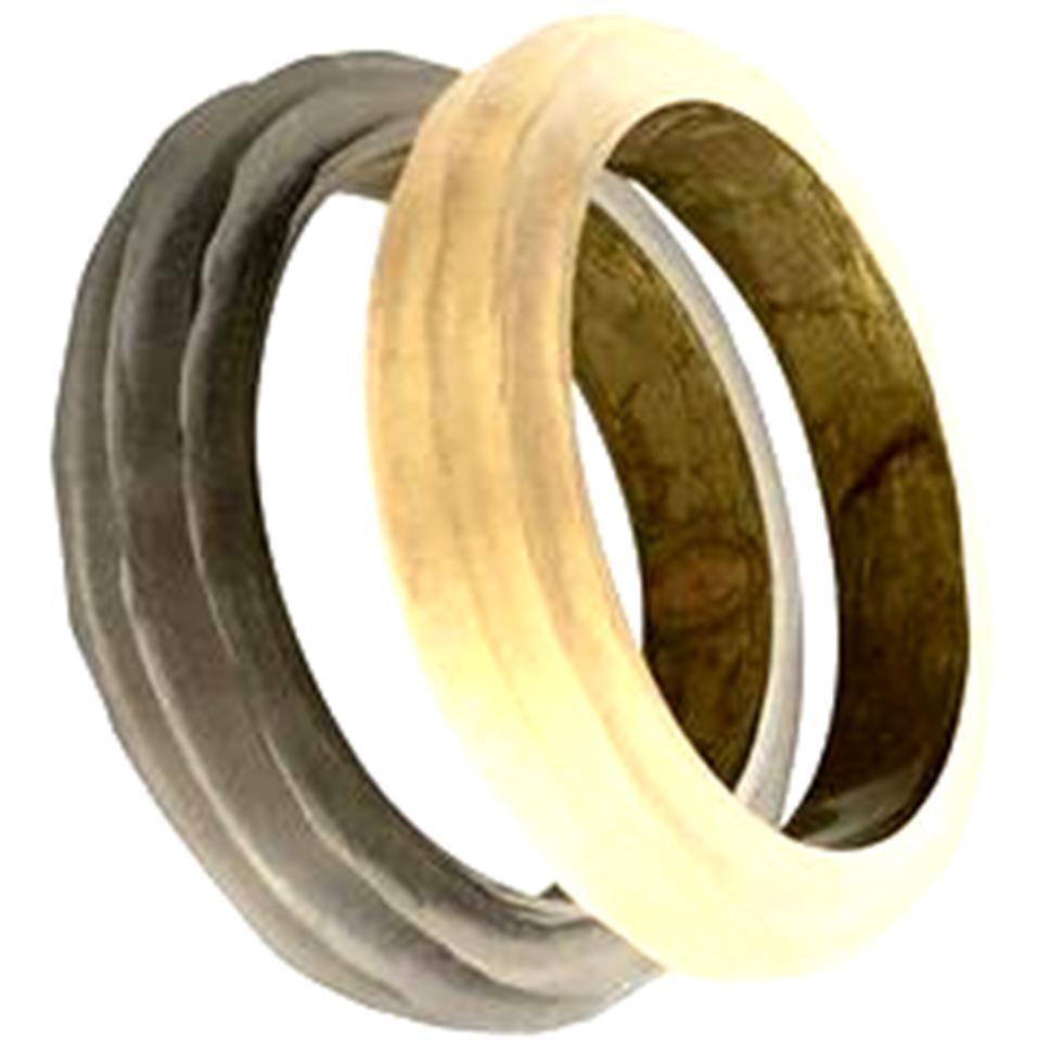 Contemporary Pair of Alexis Bittar frosted Lucite ribbed bangle bracelets. One is a champagne color the other a smoky charcoal color. Both are signed Hand Carved By, Alexis Bittar on the interior. Interior diameter, 2.5