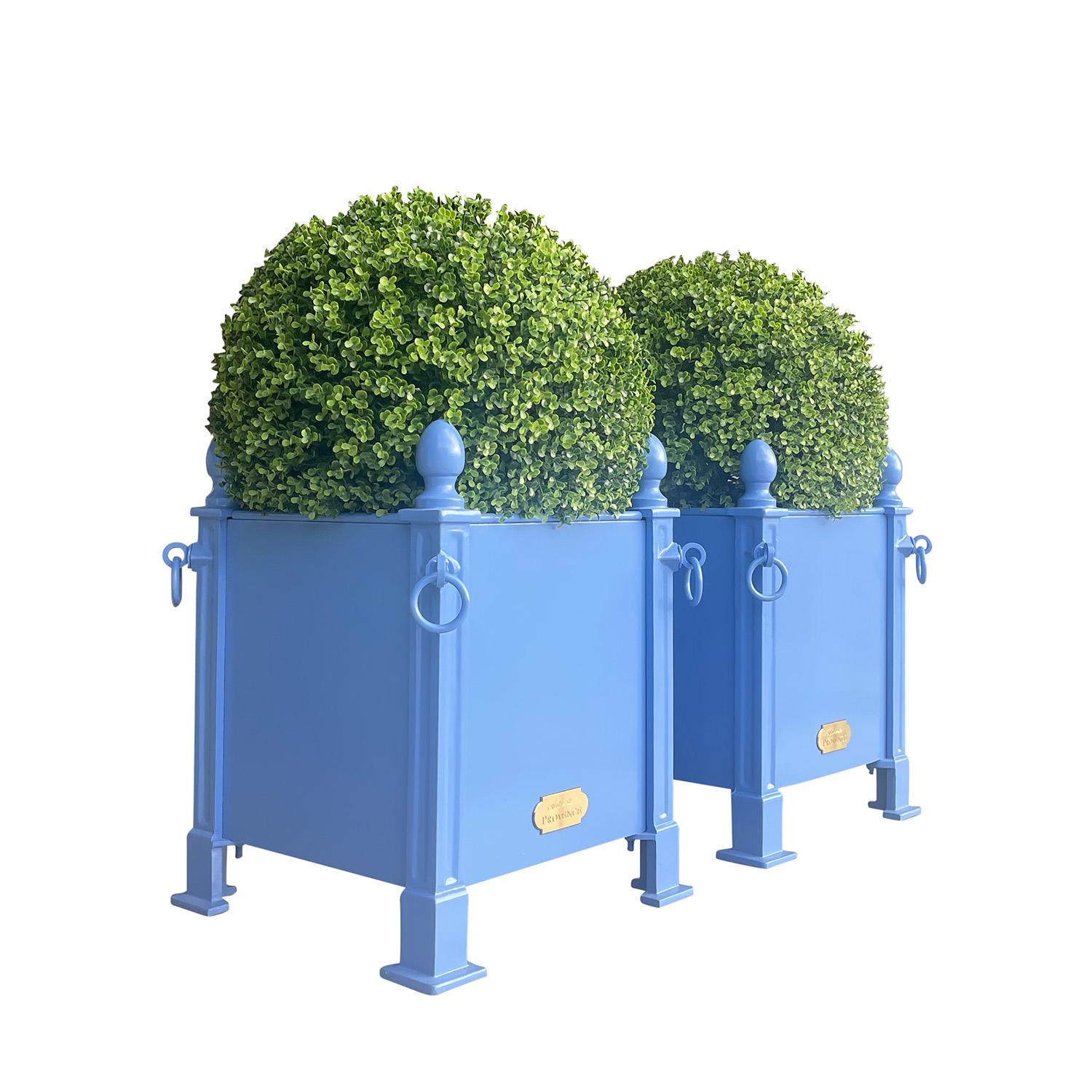 Fashionable in Paris during the 18th and 19th Centuries, this style of French planter box was often used to flank grand entrances with citrus trees or topiaries. 

Benjamin Moore Color: Paddington Blue 791