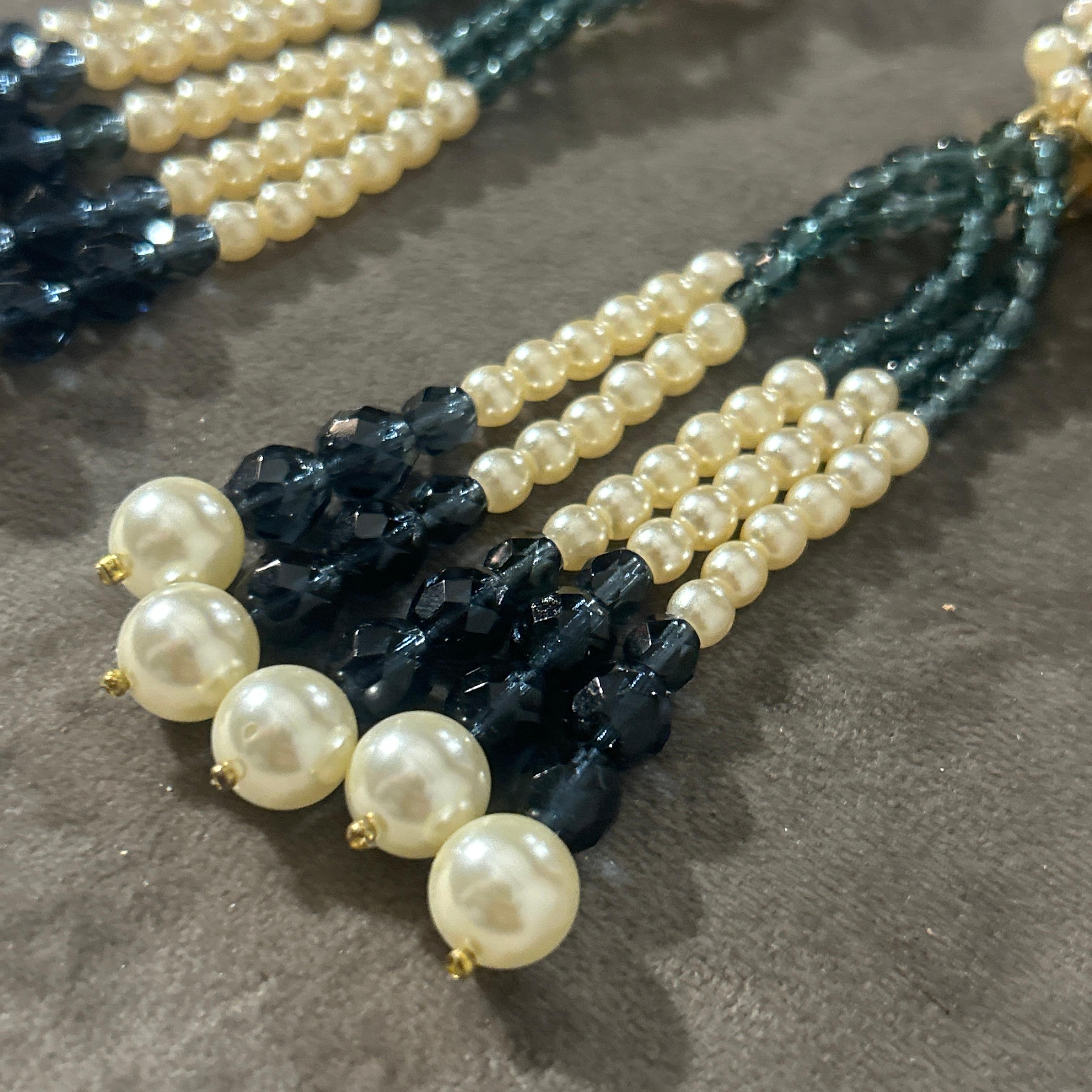 This elegant pair of earrings by Coppola e Toppo, crafted in the 21st century, exemplifies the brand’s mastery of beadwork and timeless design. These statement earrings feature a bold tassel structure made from meticulously hand-strung beads in