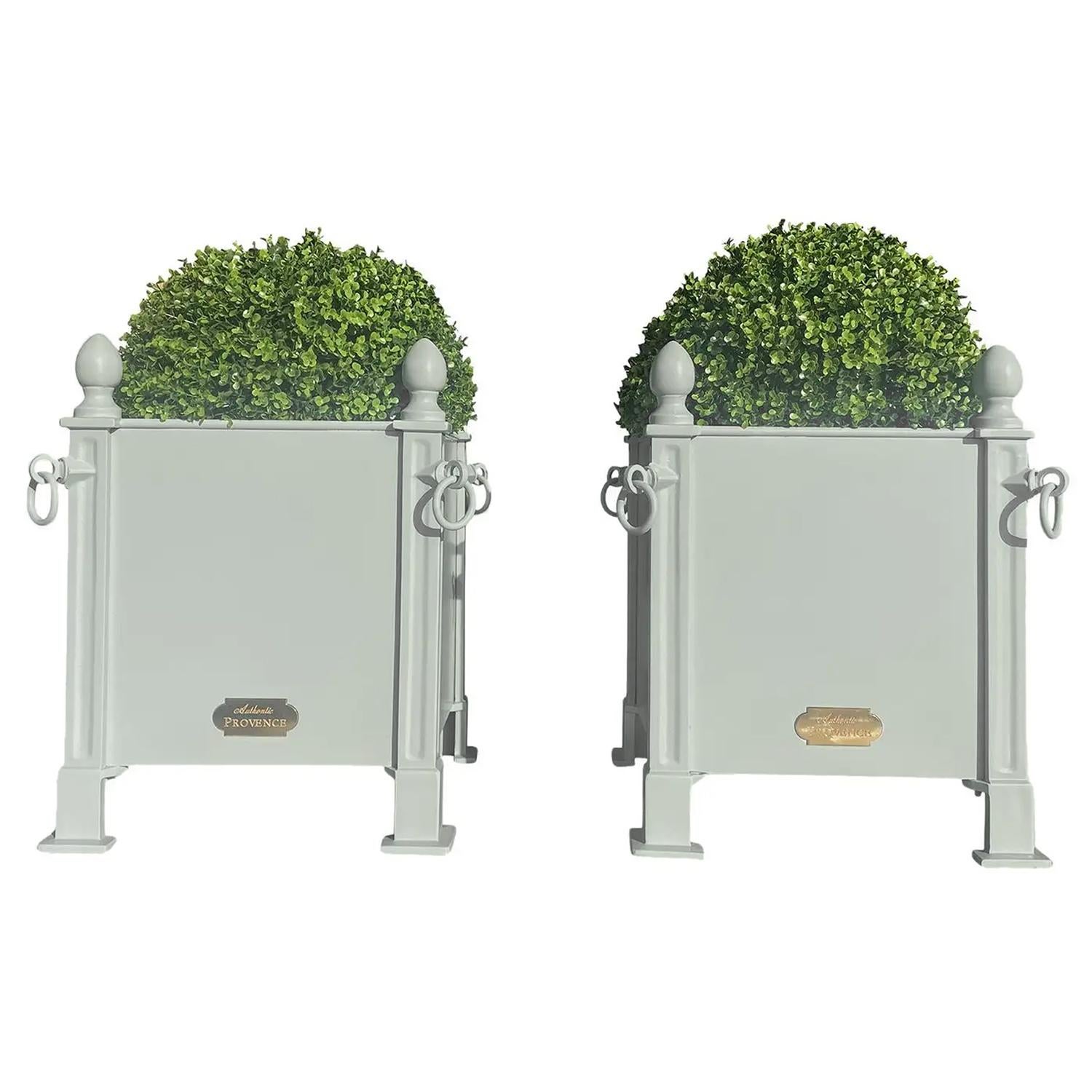 Fashionable in Paris during the 18th and 19th Centuries, this style of French planter box was often used to flank grand entrances with citrus trees or topiaries.  

Benjamin Moore 'Nelson Blue' - color CW635.