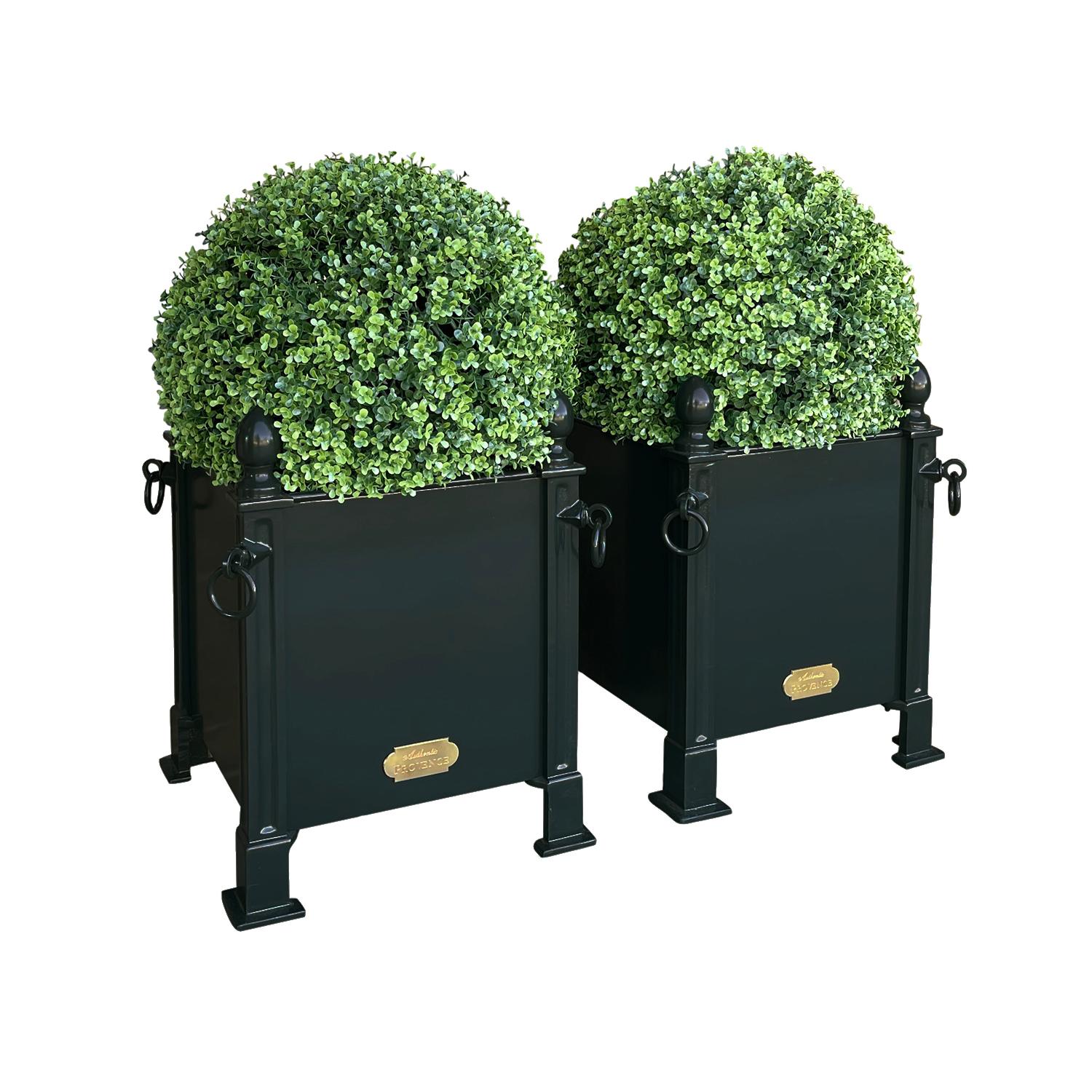 Fashionable in Paris during the 18th and 19th Centuries, this style of French planter box was often used to flank grand entrances with citrus trees or topiaries. 

Benjamin Moore Black Forest Green HC-187