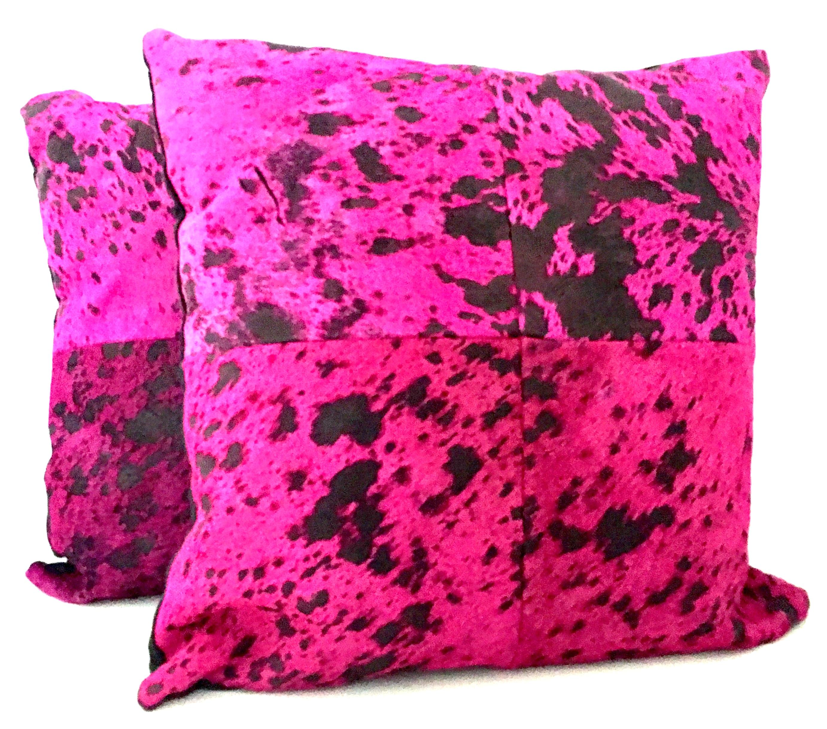 21st century and new pair of fuchsia & chocolate brown hide hair pillows. These dramatic but Classic hide hair pillows are died fuchsia and chocolate brown as slip covers. The bacj side is finished in black fabric. Each pillow included a cotton