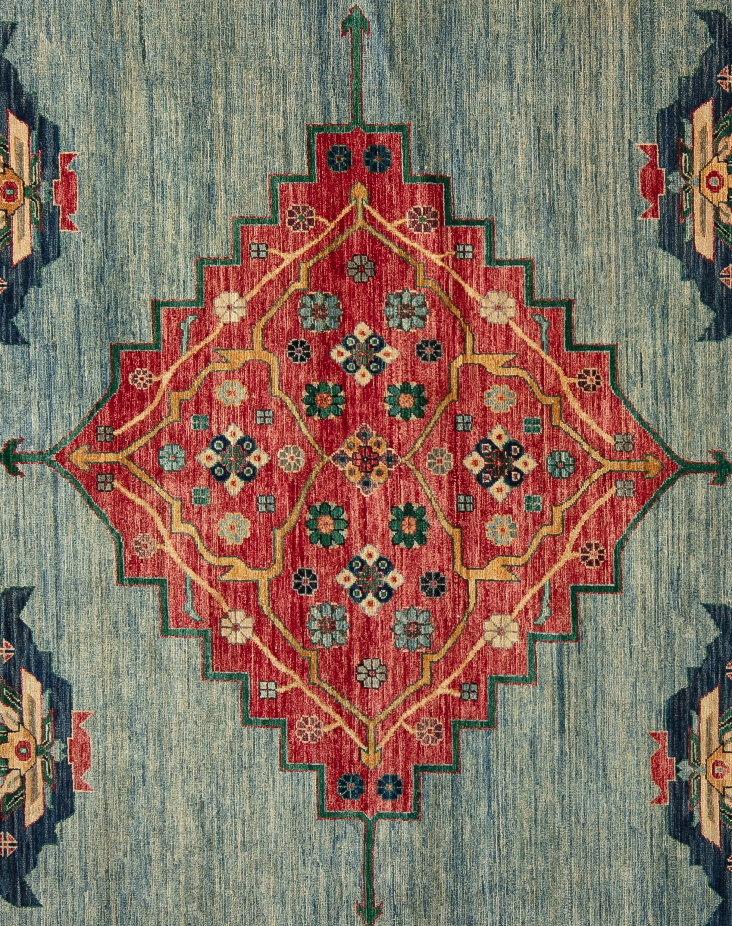 Serapi's commonly feature large scale center medallions flanked by four corner spandrels, and an organic palette of breathtaking colors, inspired by nature. This rug has floral patterns throughout such as the tree of life symbolizing a direct path
