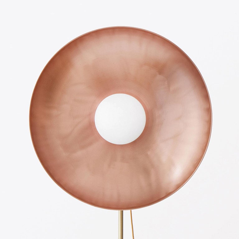 The parabola copper lamp is a floor lamp with a bold and rare aesthetic. This lamp has an adjustable brass base and a dimming switch, which allows to create a warm and charming environment, thanks to the fascinating surface of the copper disk. The