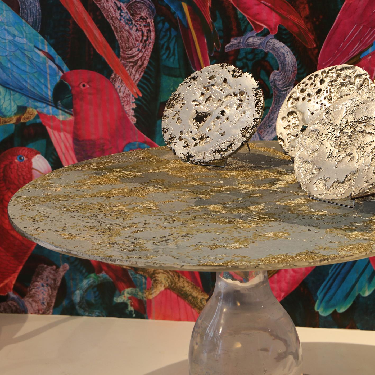 Made in France: On a rare  galactic crystal pedestal, made of the clearest resine, this contemporary pedestal table is a unique piece, created by Xavier Lavergne and sold with its authenticity certificate. The top is made of melted pewter, brass
