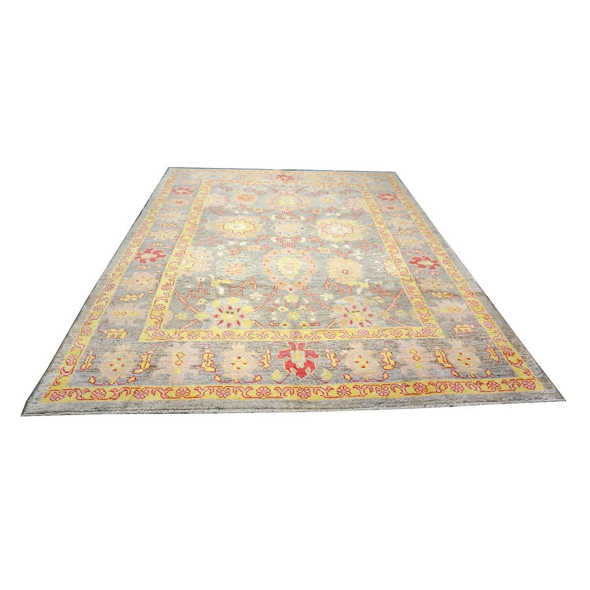  Ashly Fine Rugs presents a 21st-century Persian Oushak 8x10 grey, red, & yellow handmade area rug. Oushaks began in a location just south of Istanbul, in a region that was to become the rugs namesake, Oushak. Although nomads first produced the rugs