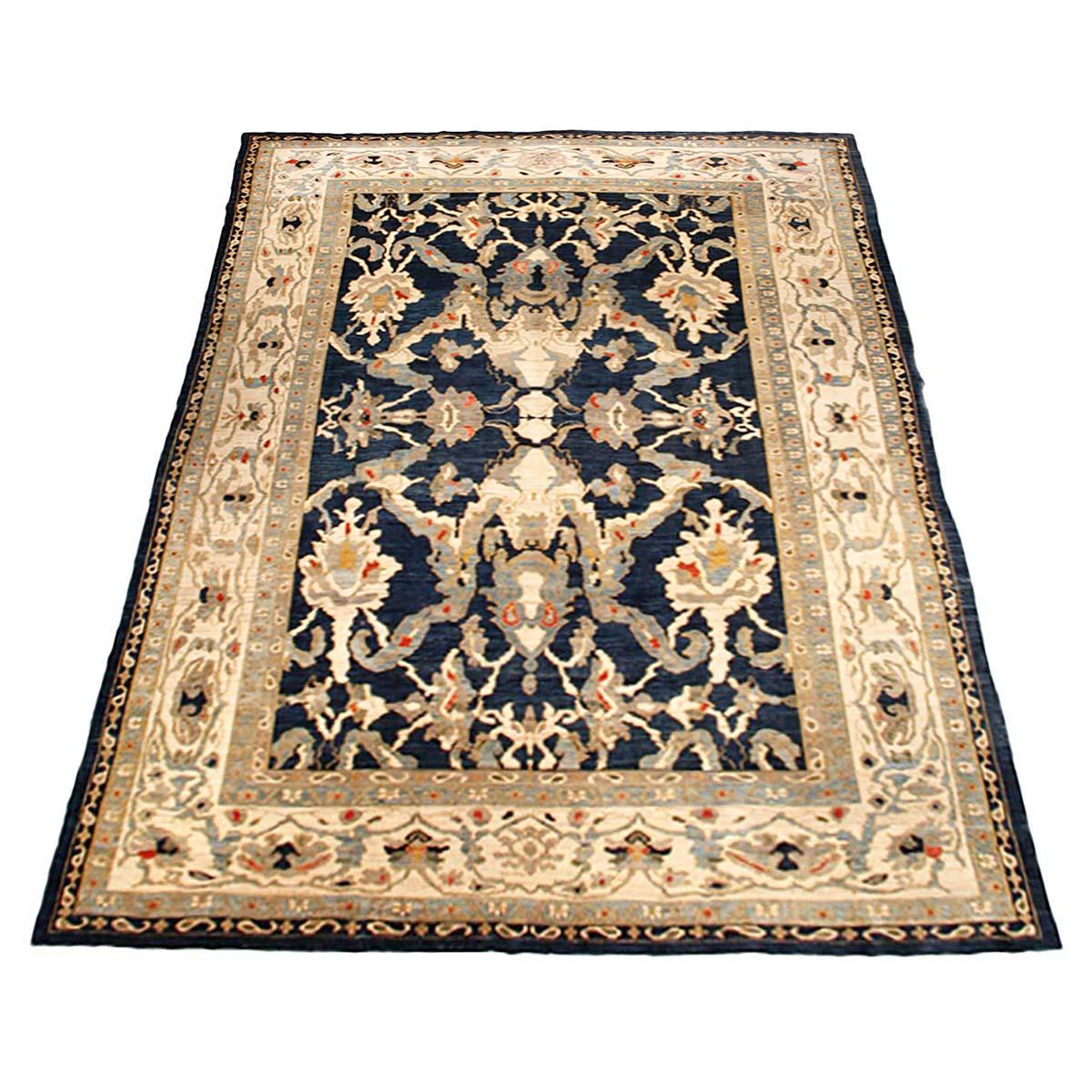 Ashly Fine Rugs presents an antique recreation of an original Persian Sultanabad 12x16 Navy Blue & Ivory Handmade Area Rug. Part of our own previous production, this antique recreation was thought of and created in-house and 100% handmade in Iran by