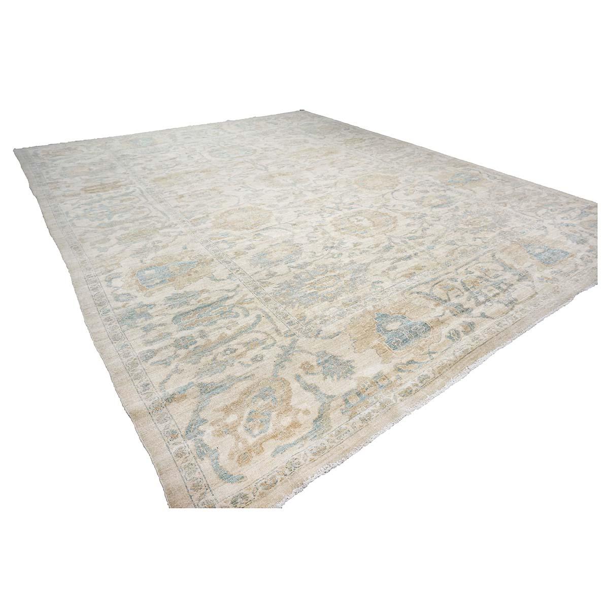 Ashly Fine Rugs presents an antique recreation of an original Persian Sultanabad 12x14 Ivory & Tan Handmade Area Rug. Part of our own previous production, this antique recreation was thought of and created in-house and 100% handmade in Iran by