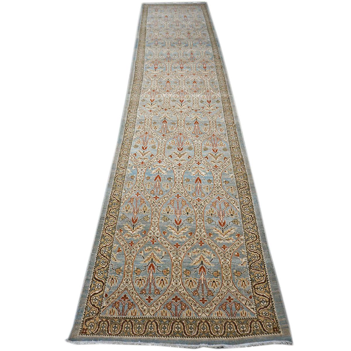 Ashly Fine Rugs presents a New Persian Tabriz 3x15 blue and ivory hall runner area rug. Tabriz is a northern city in modern-day Iran and has forever been famous for the fineness of its handmade rugs. This piece has a light blue colored background
