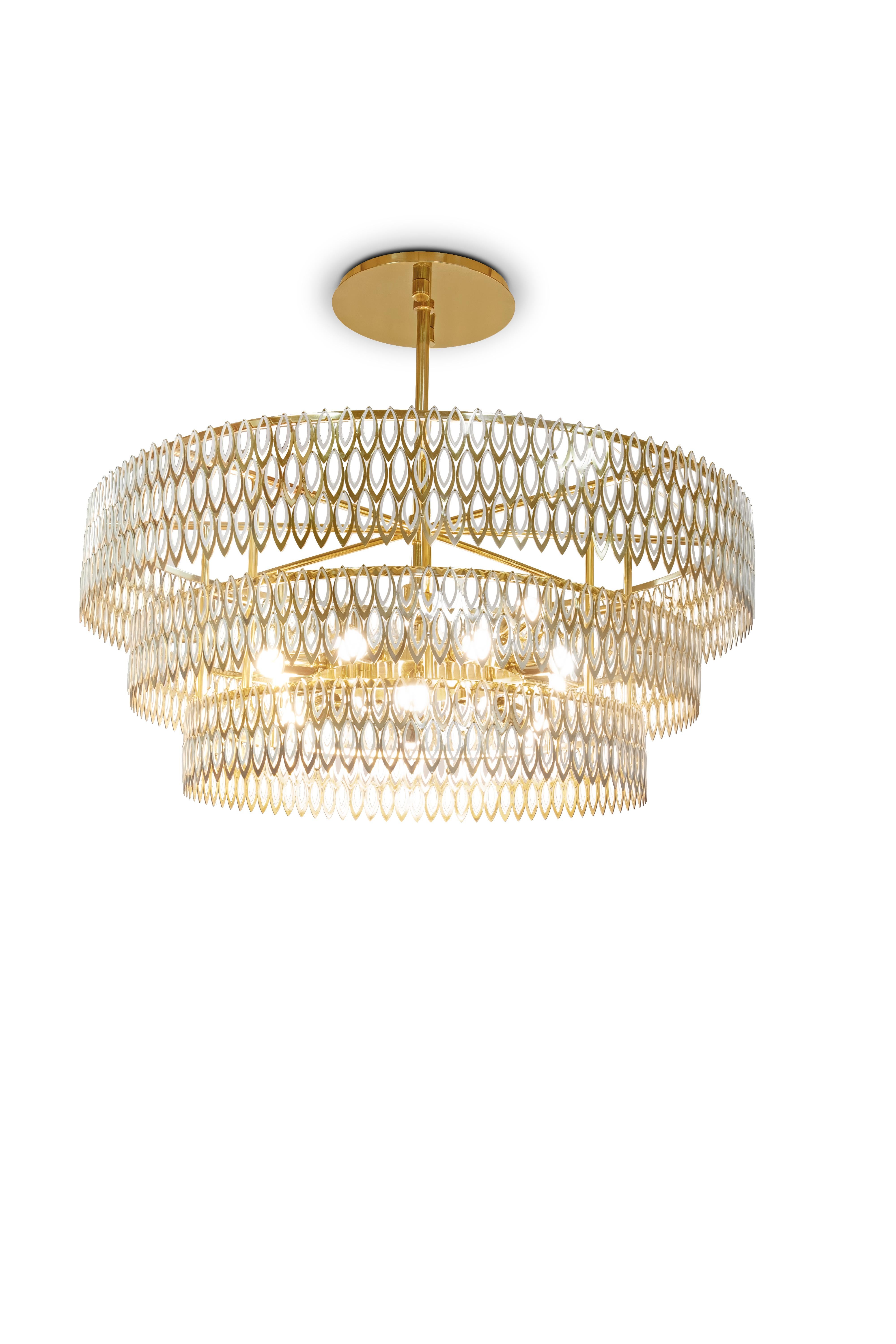 Petal is a modern chandelier which brings to any interior design set a luxurious presence. Its 3 imposing tiers of petal-shaped brass rings, finished with a rhythmic combination of of lacquered stainless steel with brass varnish finish, reflects the