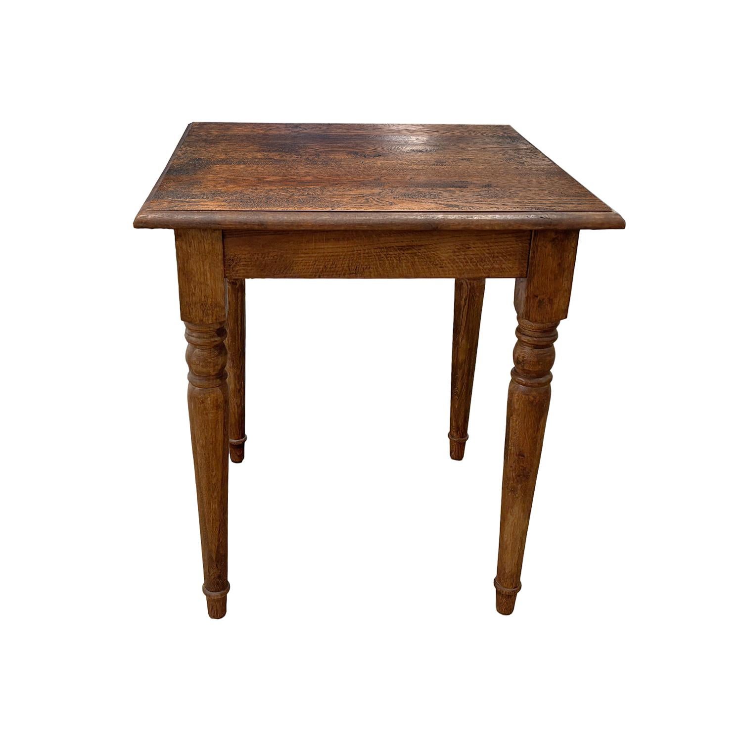 A small square side table made of hand crafted Pinewood from France, in good condition. Wear consistent with age and use. 