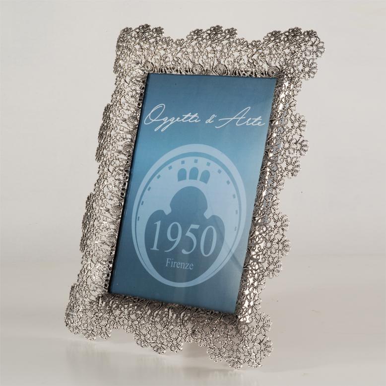 Elegant picture frame made of lost wax casting bronze, silvered,  ideal for enhancing your most precious memories. Italian artisan product. The richly decorated border features a delicate floral motif, created using the lost wax casting technique.