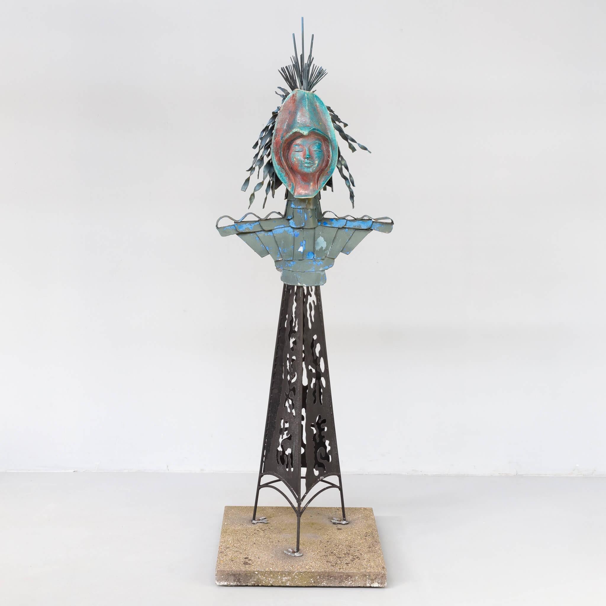 Ad Martens “Koningin”, A large polychrome ceramic, zinc and metal sculpture of an abstracted female figure with headdress on a three-pronged structure with an openwork surface on a granite base. 21st century, the Netherlands.
After a stay at the St.