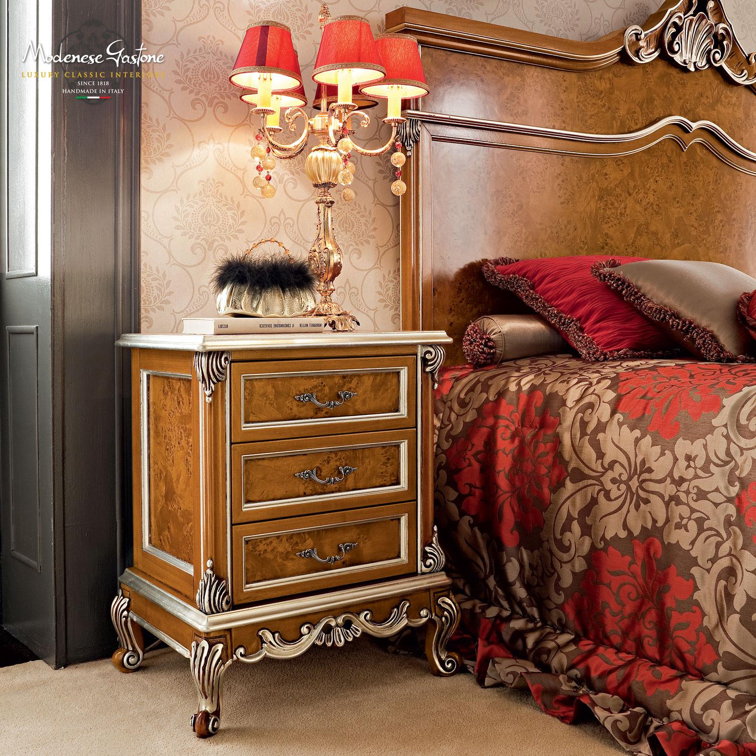 Breathtaking baroque night stand with radica panels by Modenese Gastone Interiors. The natural wood structure and the carved details contribute to the harmonious movement of the overall design, which is great in classic-style bedrooms with