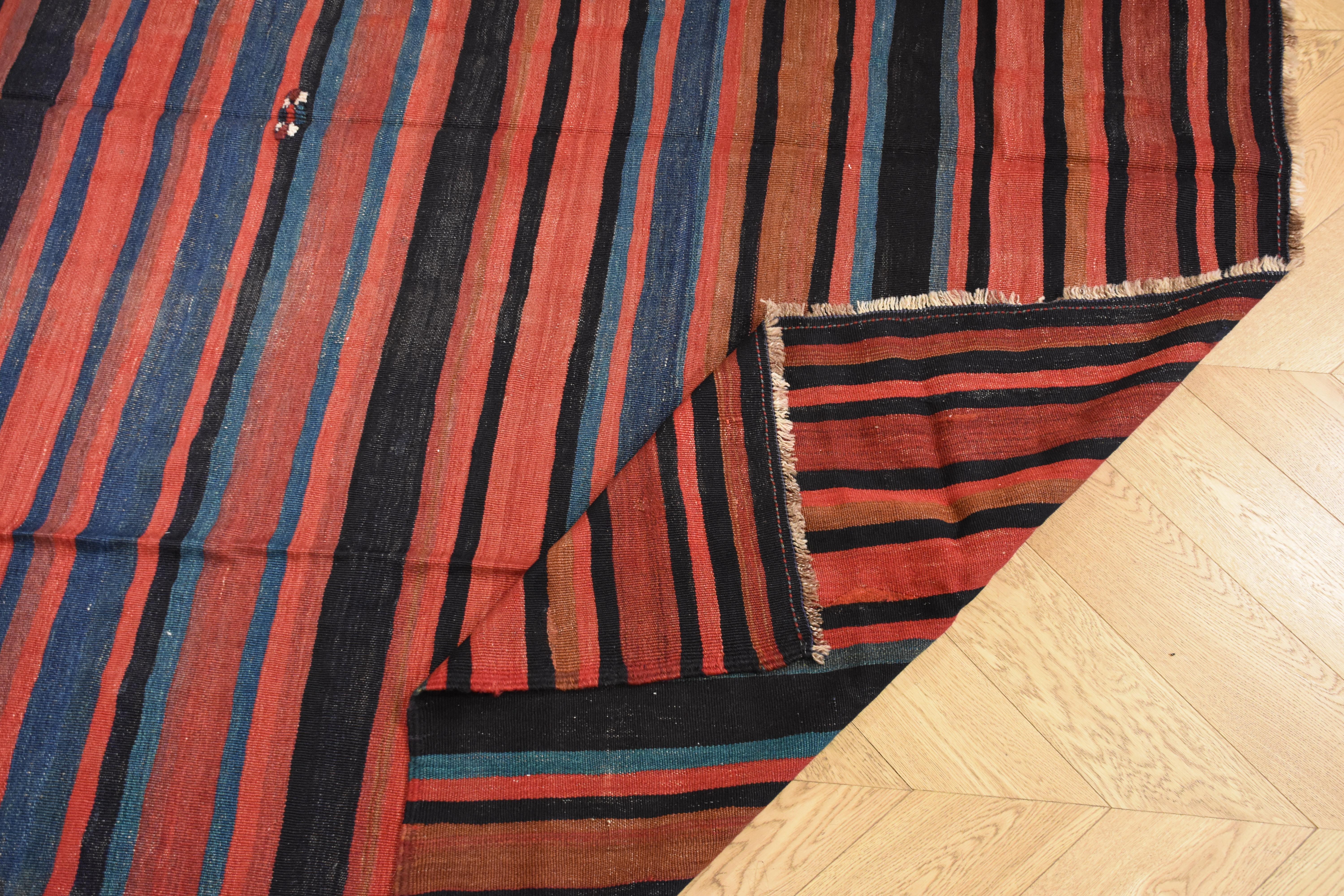 The Kilim is a rug without fur, woven like a tapestry, with only warp and weft. It is a typical product of nomadic populations, which use these artifacts for their daily use, as a couch, to delineate the spaces inside the tent and as a cover to
