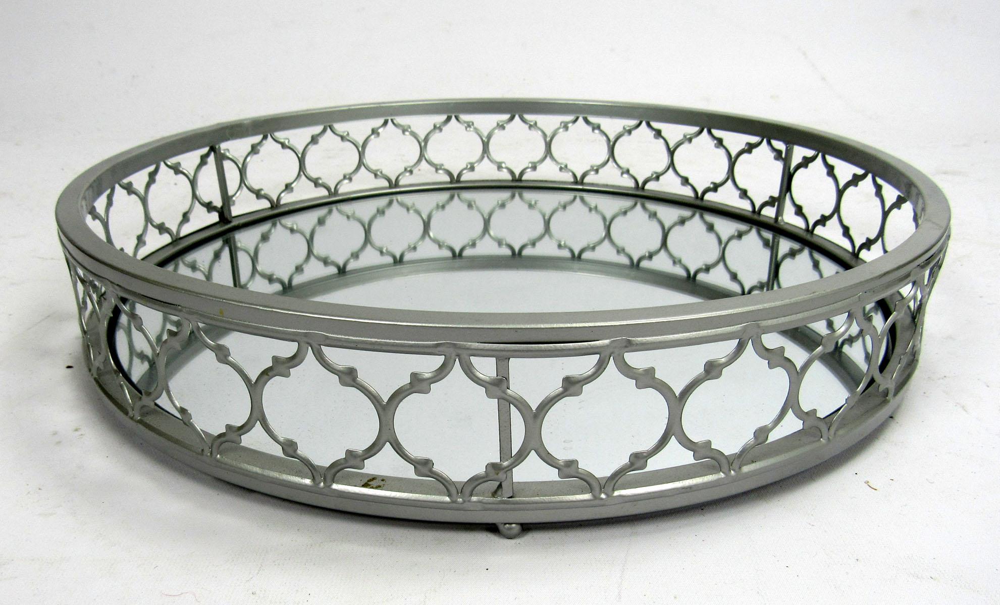 Round decorative tray with metal gallery and mirrored surface.