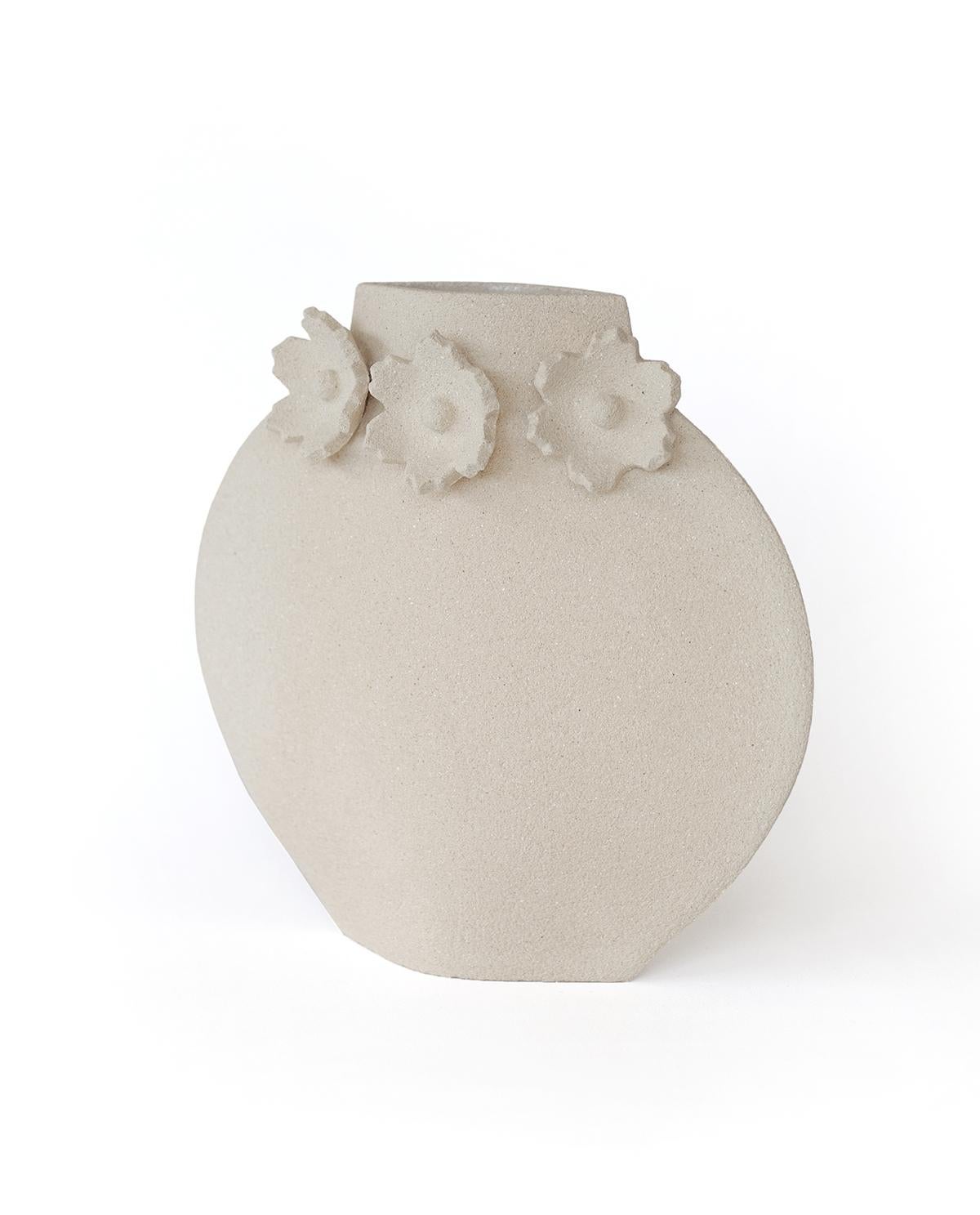 'Sculptural Flowers' Handmade White Ceramic Vase

This vase is part of a new series inspired by flowers (and more generally organic elements). Here is our Lune [M] model with motifs of camellia flowers. They are hand-sculpted and attached to the