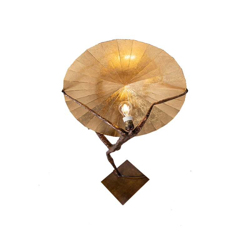 21st century sculpturale table lamp Sisyphe by Fantôme

Patinated bronze 
Imbalanced male character 
Reflector in patinated & gilded brass 
Measures: H. 37.4’’ x 23.6’’
Numbered 2/8, Signed, delivered with a certificate of