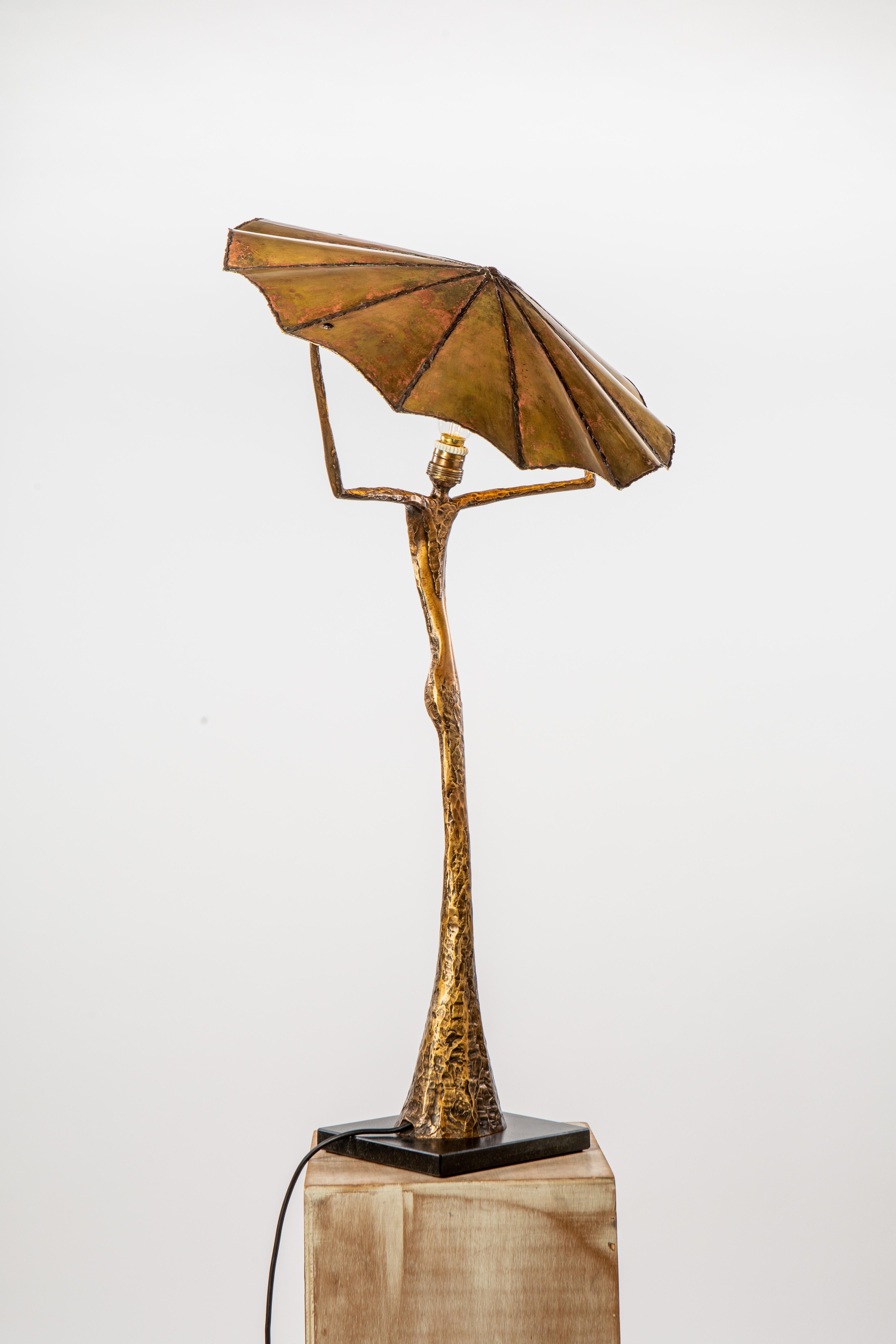 21st century sculptural table lamp V. MARS by Fantôme

Patinated bronze,
Stylised female character,
Gold plated brass reflector,
h. 37.8’’ x 18.5’’,
Numbered 4/8,
Signed, delivered with a certificate of authenticity.

This Sculptural Lamp pays