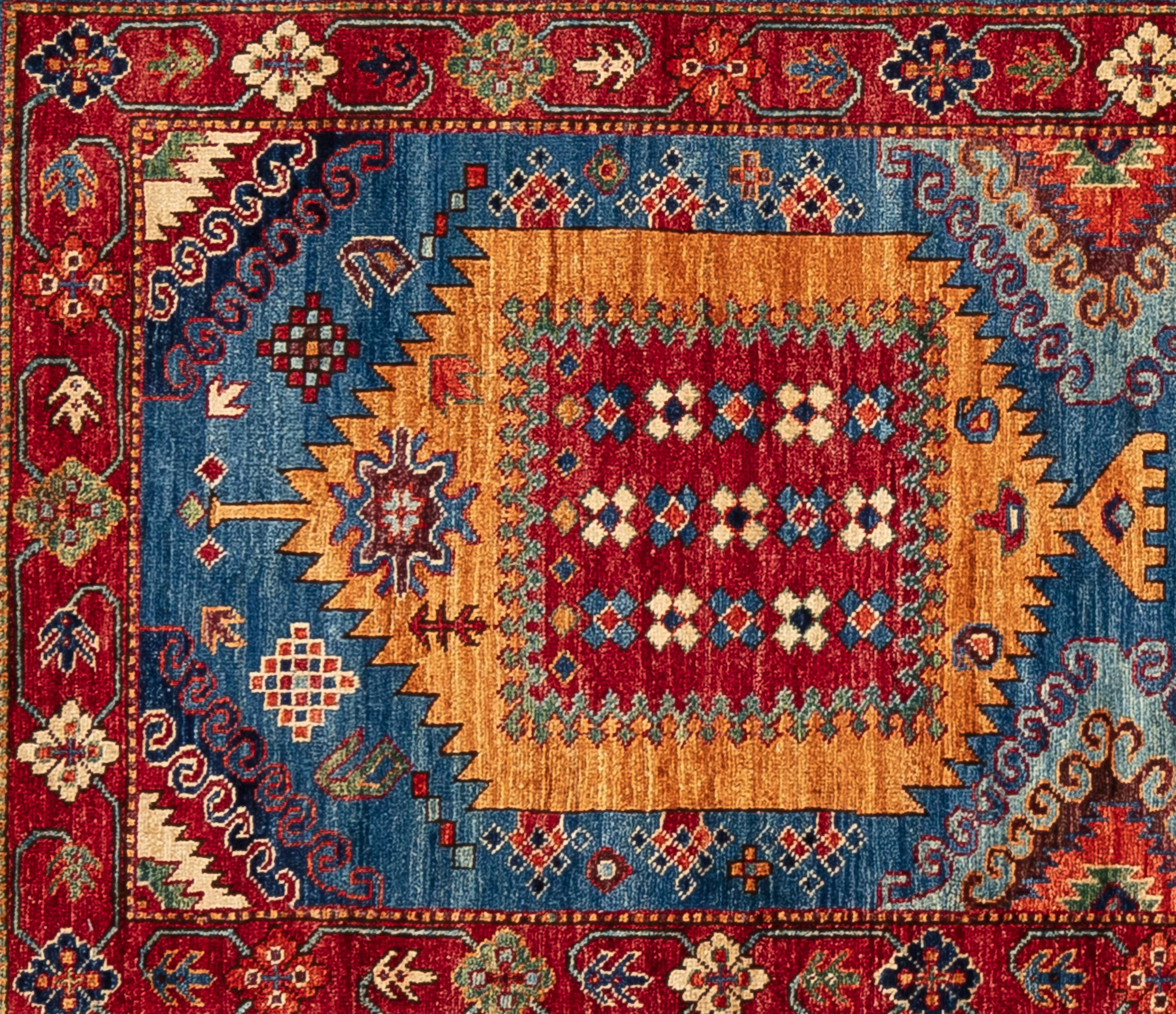 Handwoven by master weavers and made of 100% wool, this Serapi runner features geometric center medallions and a floral border. With a ruby field and variants of blue and cream.  
 
Size - 2'8
