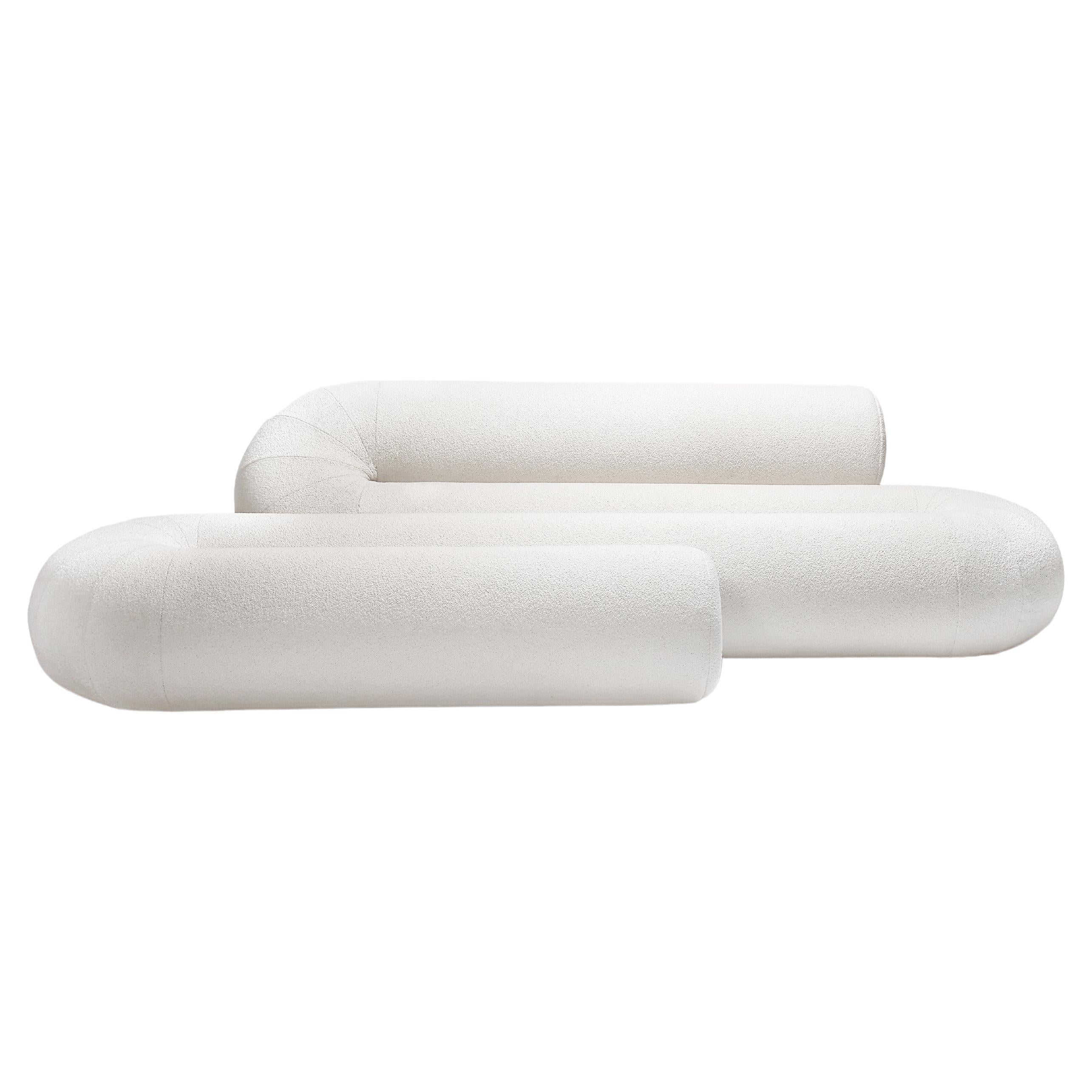 Serpentine takes the challenge of rethinking a modern sofa by incorporating different
seating solutions in one fluid object. The alternation of back and leg support mimics
the functionality of a classic seat, a pouf, and a chaise longue.