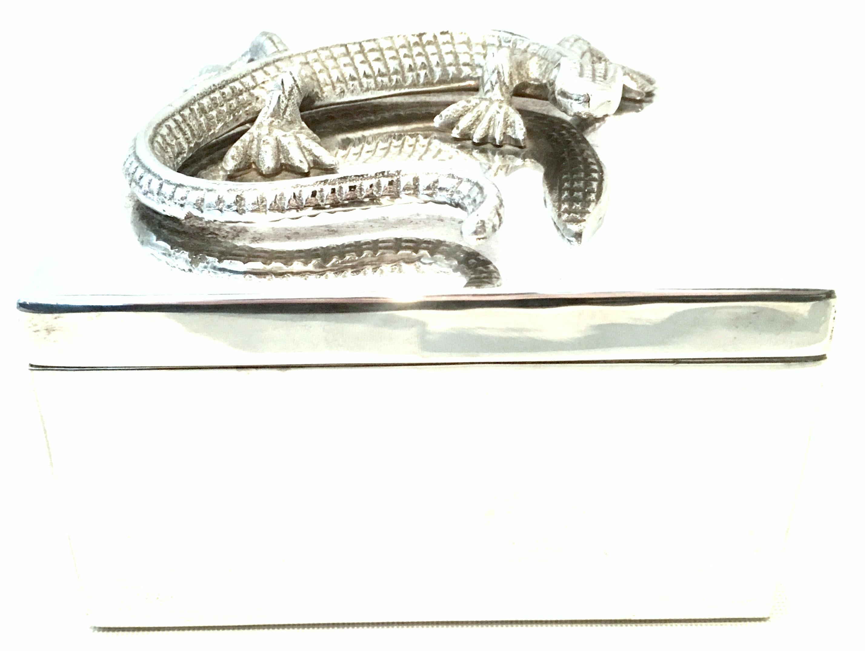 21st Century silver plate lizard box. This silver plate two-piece lidded box features a sculptural and applied lizard form at the top of the lid. The size of lizard is approximately, 6
