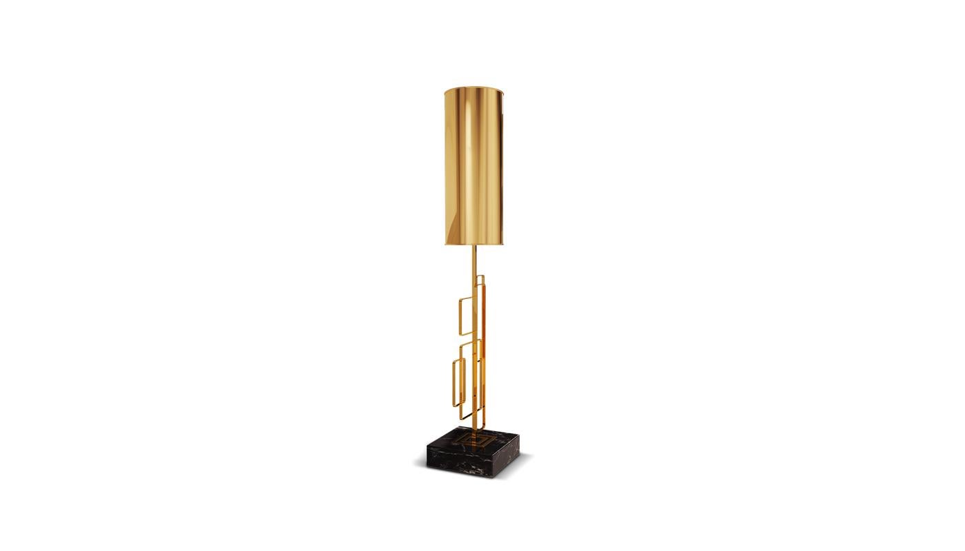 The Skyscraper contemporary table lamp is supported by three geometric structures in polished brass while the body is formed with the combination of the beautiful Spaniard Negro marquina marble with polished brass. This structure is the key point of