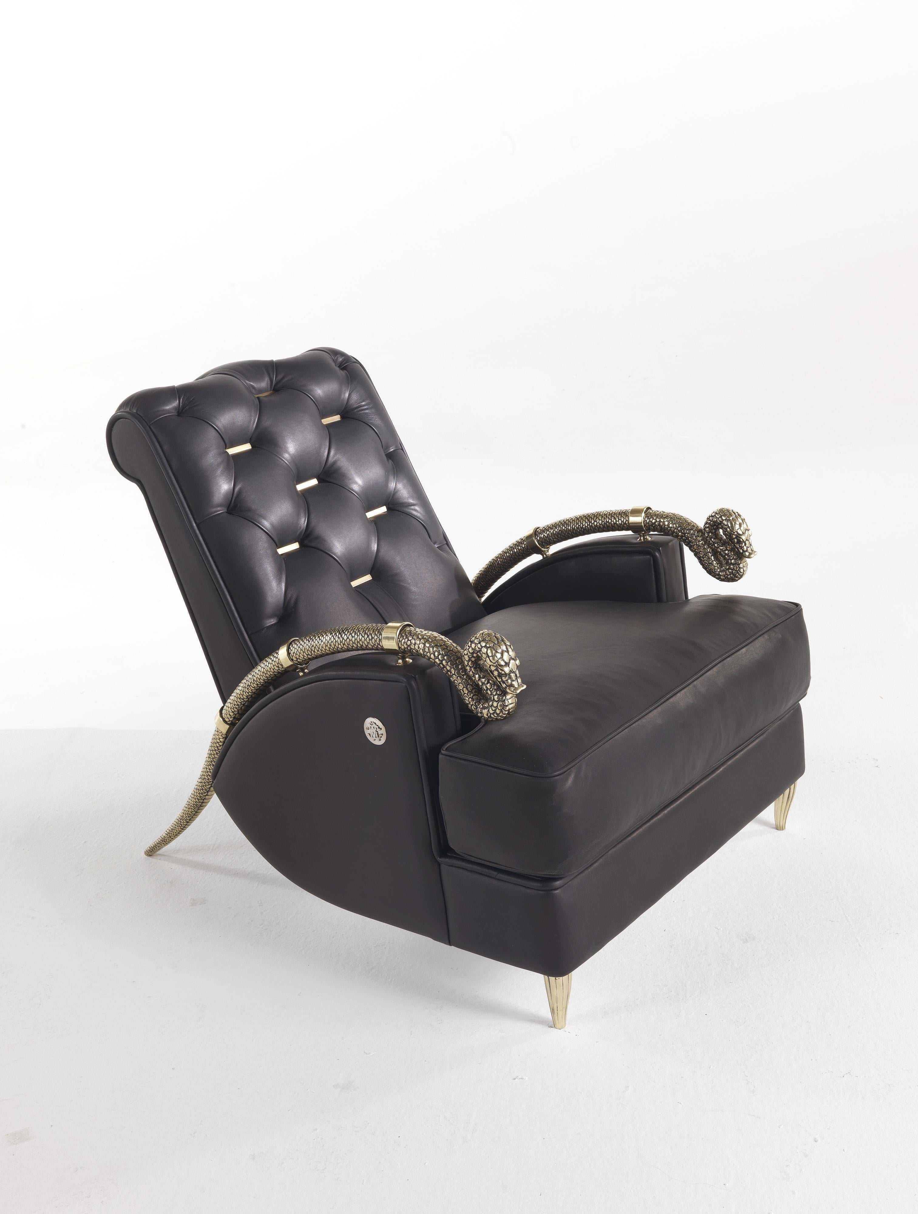 Animals inspire interiors! A really aggressive armchair with the two golden snakes that act as armrests, recalling the rich details used in Roberto Cavalli's world. 
Snake Armchair with structure in poplar wood and foam. Upholstery in leather CAT. A