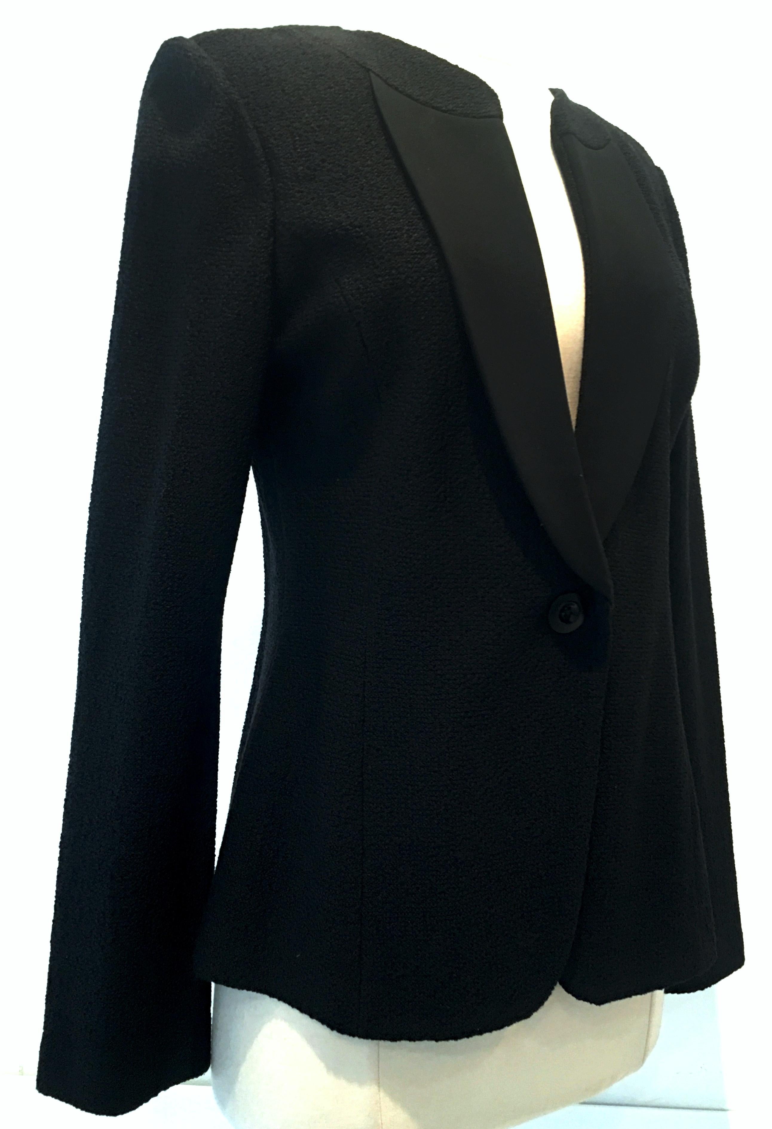 21st Century St. John Black  Silk Knit Jacket. This single breasted silk knit nubby blend jacket features silk chiffon lapels with a single button closure.
Marked on the interior with original manufactures label St. John -Size 8 - Made In The USA
