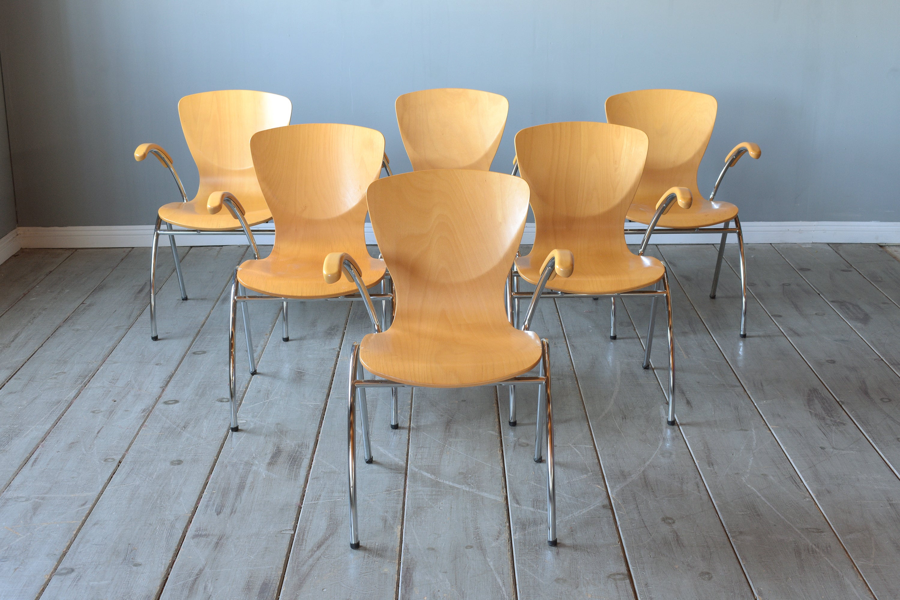 Elevate your dining experience with our exceptional set of six 21st-century mid-century modern dining chairs, a perfect blend of contemporary design and classic mid-century style. These chairs have been hand-crafted from high-quality beech wood and